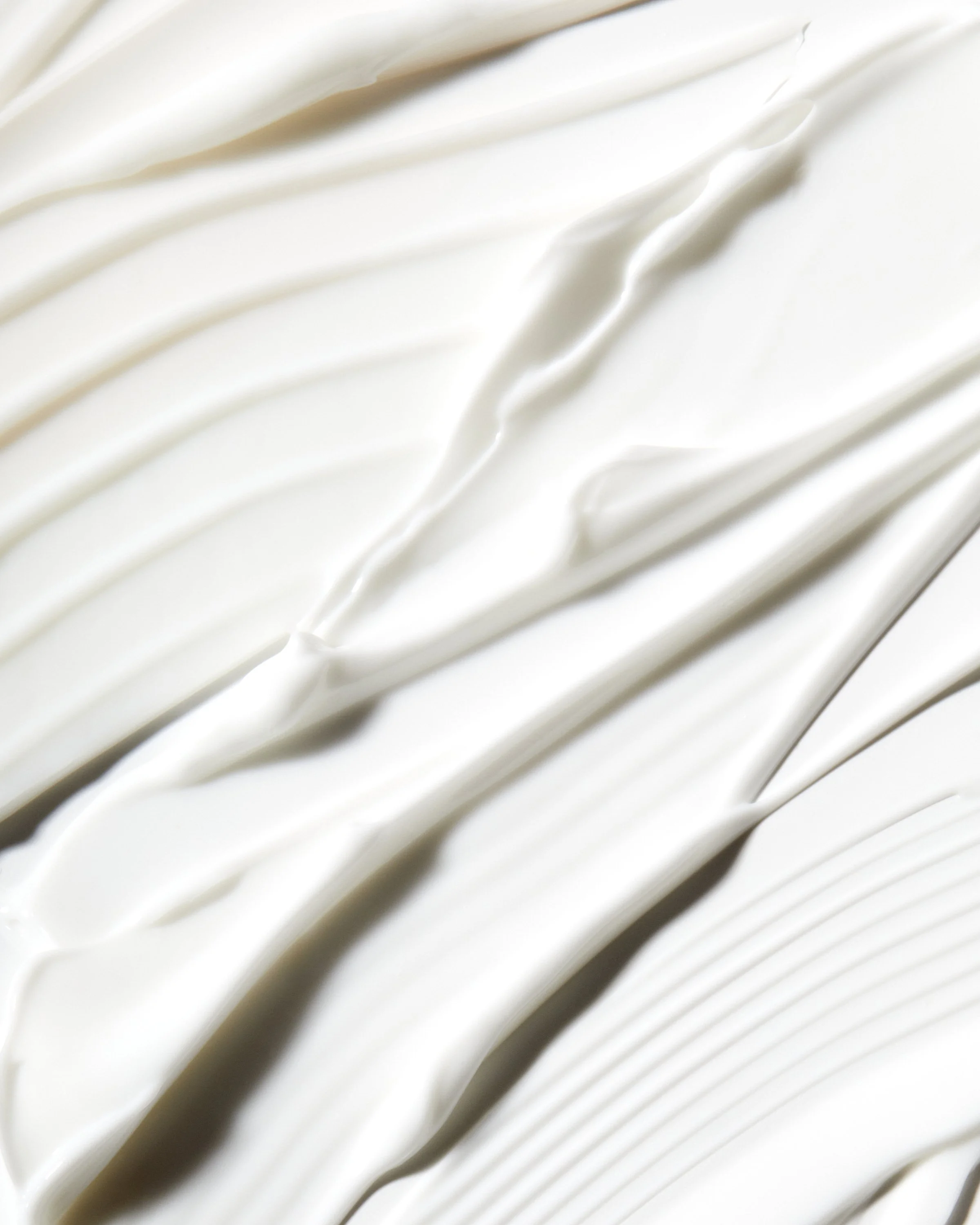 Luxury body lotion texture swipe by Adrianna Favero, NYC-based beauty photographer. Clean, radiant lighting highlights skincare textures —ideal for campaigns, e-comm, and editorial beauty stories.