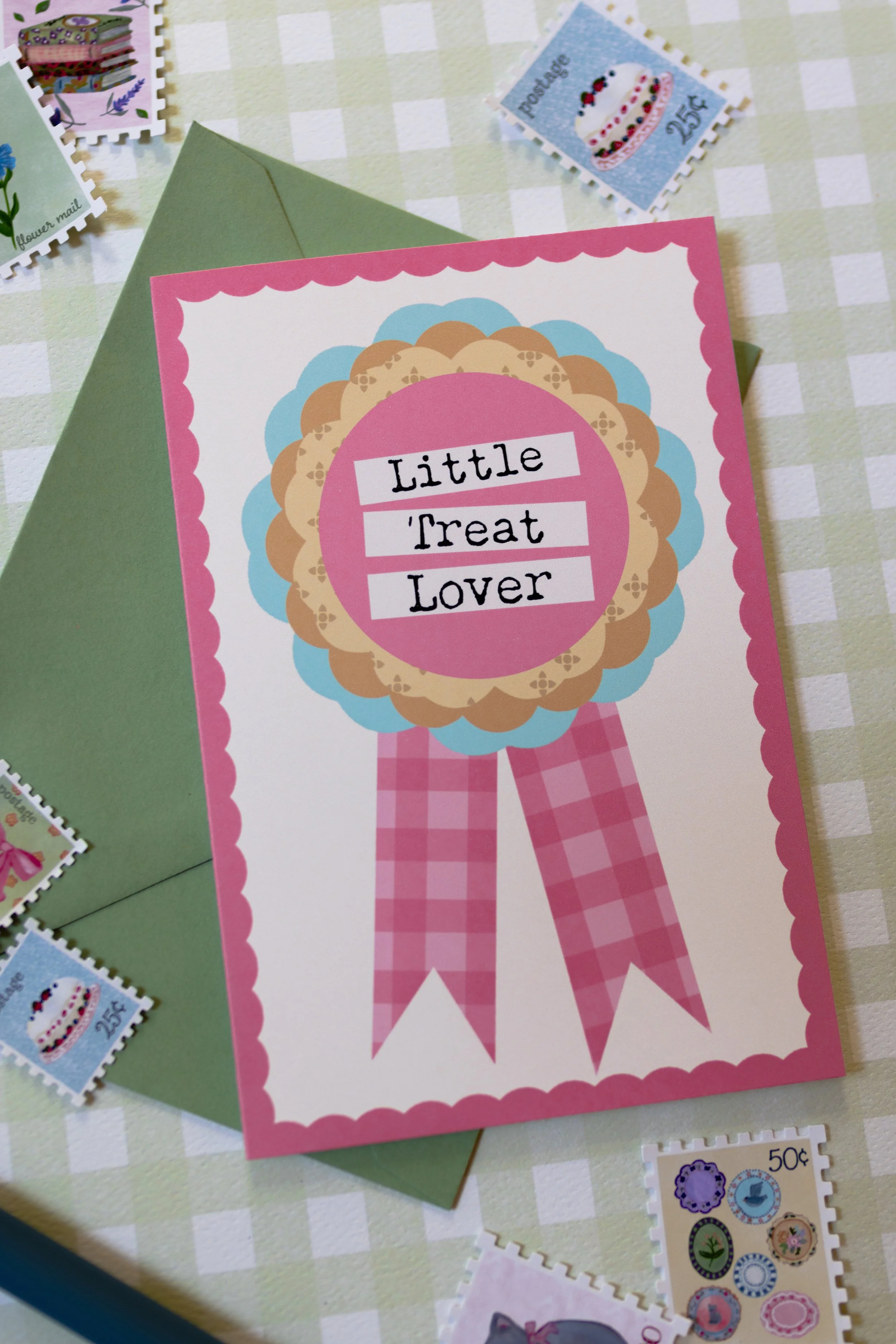 Little Treat Lover greeting card featuring vintage-inspired award ribbon illustration.