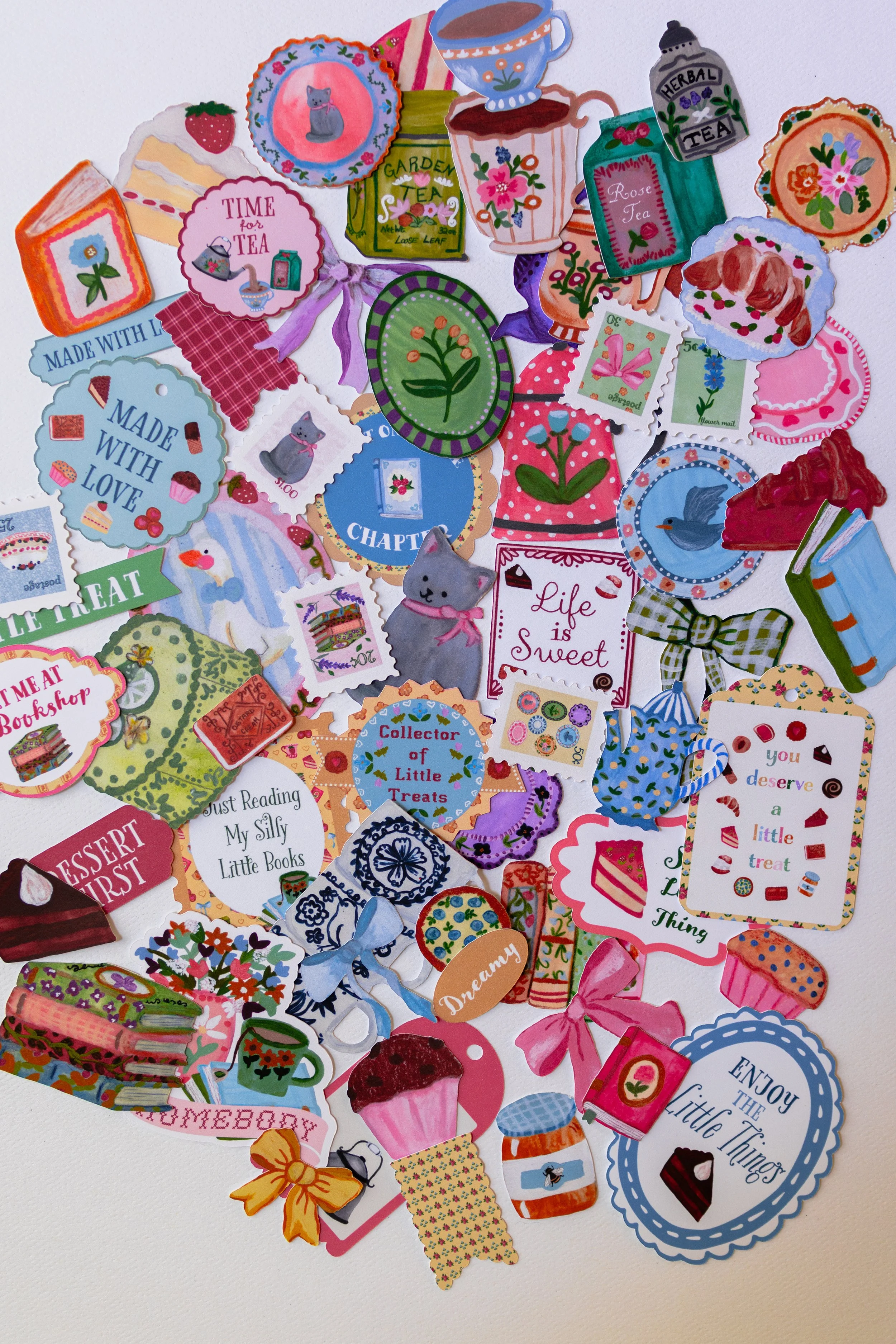Full-color die-cut embellishments for memory keeping and paper crafting.