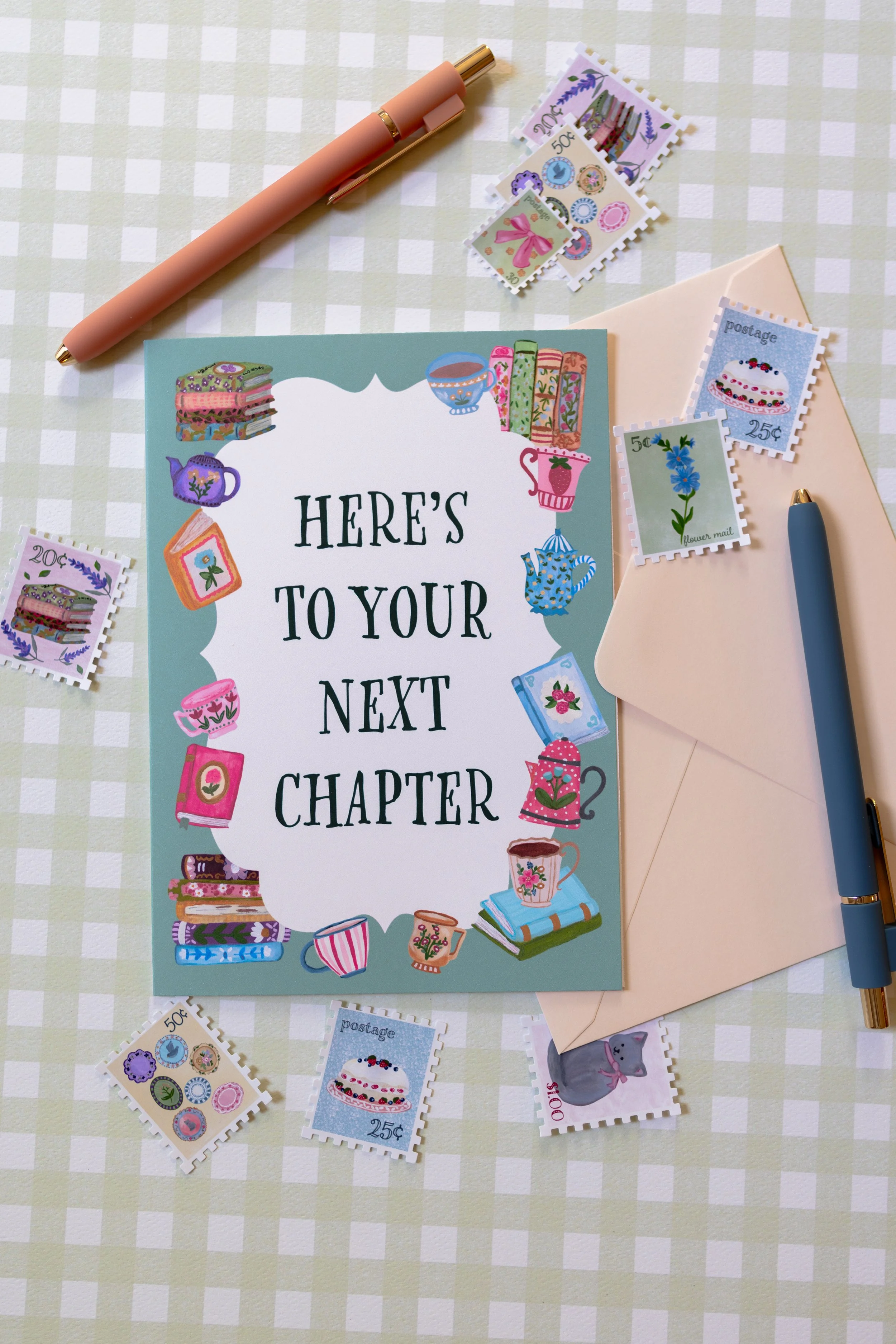 Here's to Your Next Chapter greeting card with illustrated books and teacups.