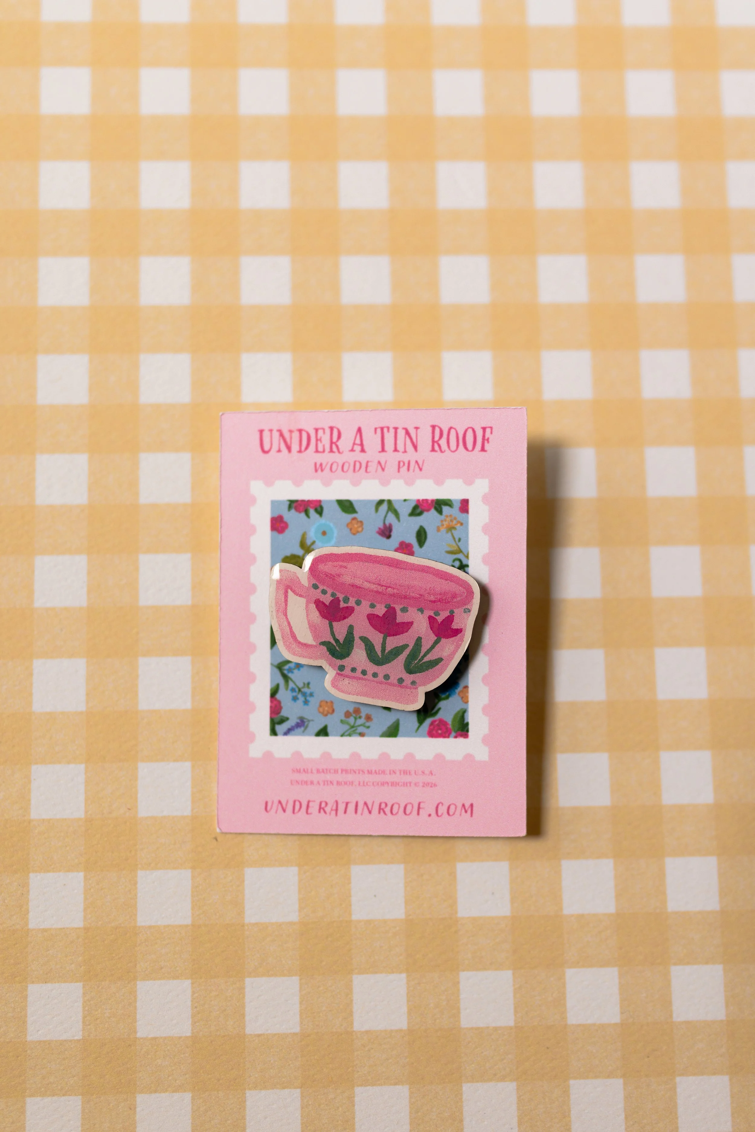 Lightweight floral teacup pin for decorating jackets, tote bags, backpacks, hats, and lanyards.