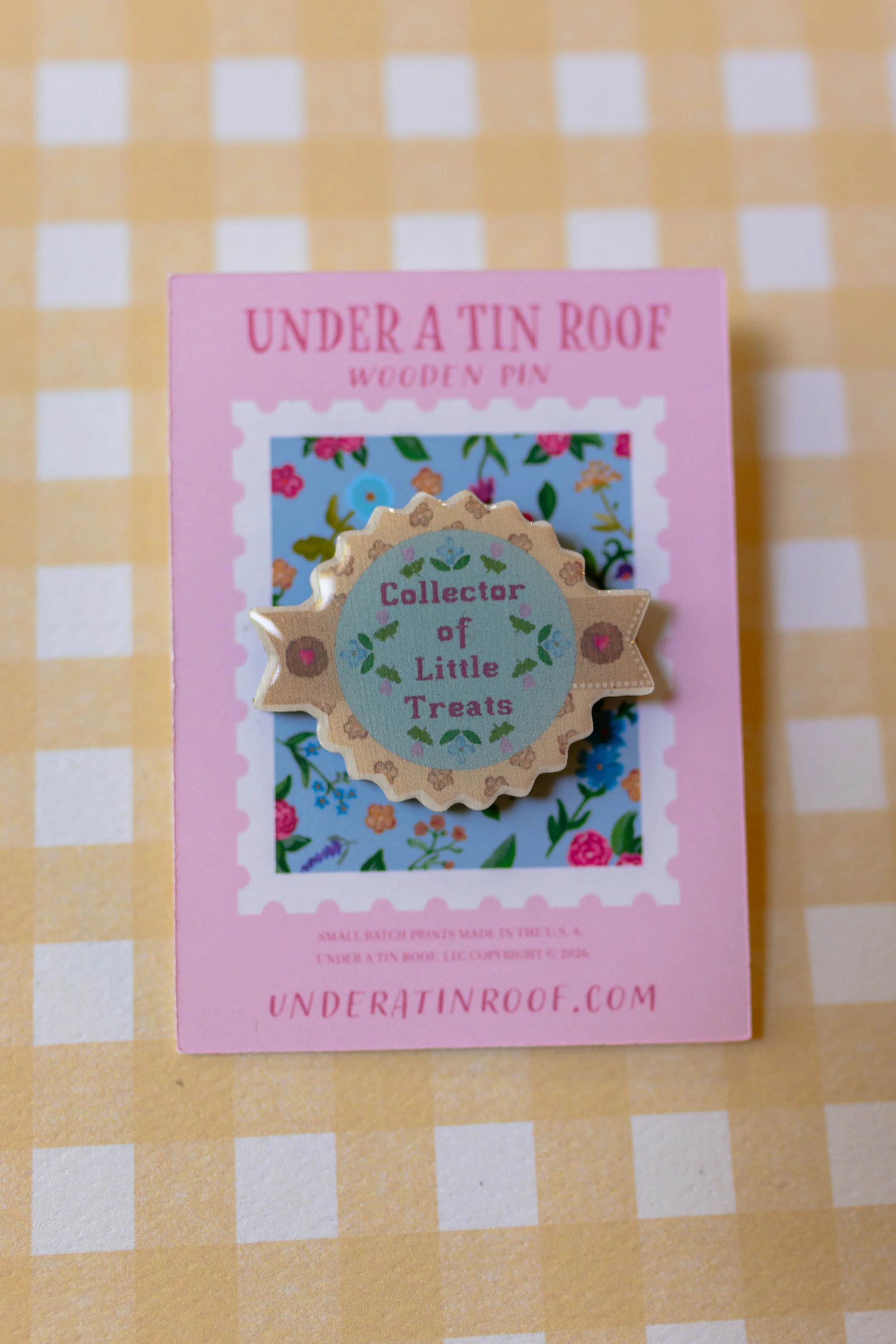 Original illustrated wooden pin celebrating desserts, afternoon tea, and the Little Treat Society.