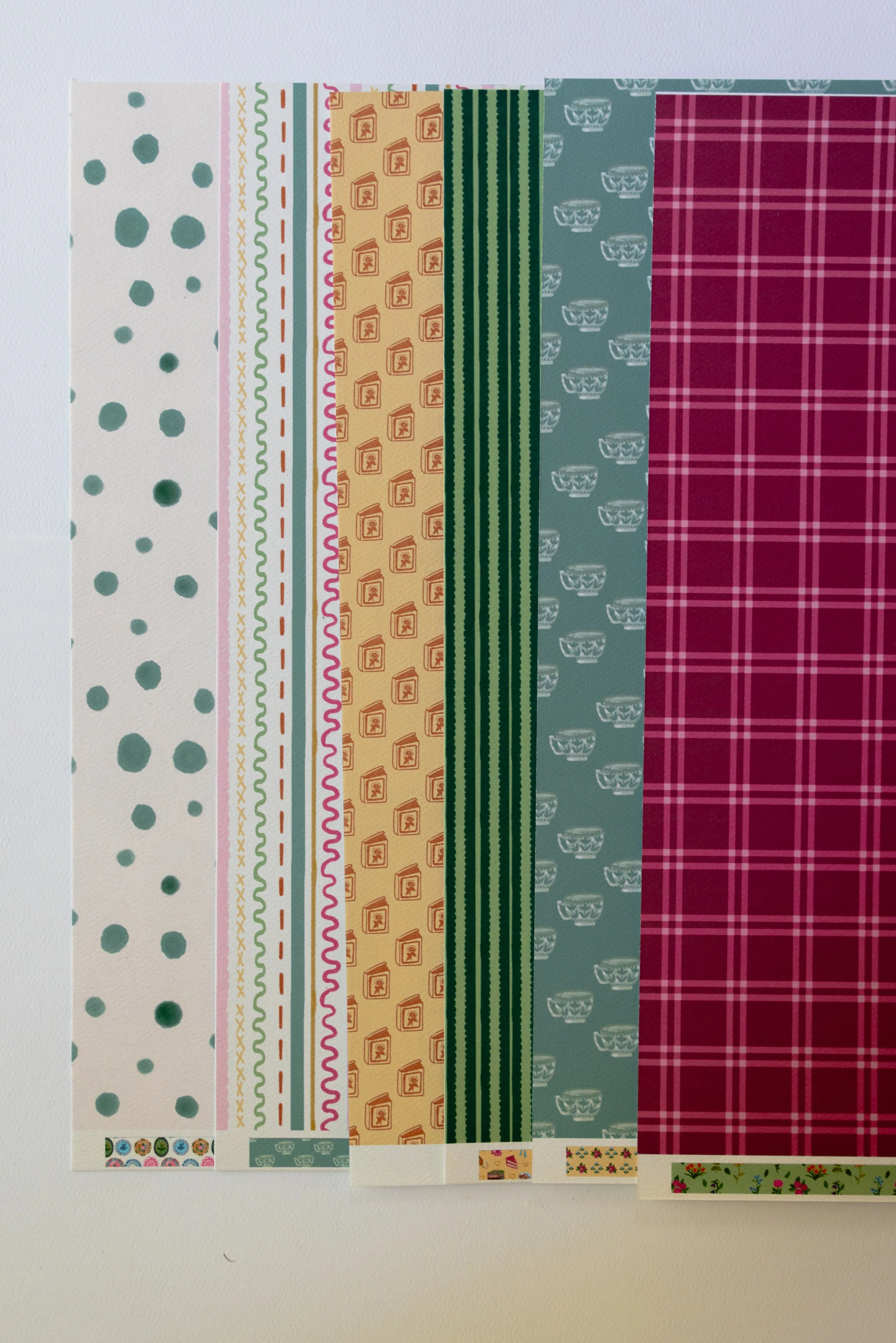 Coordinating scrapbook supplies designed to mix and match for creative paper crafting projects.