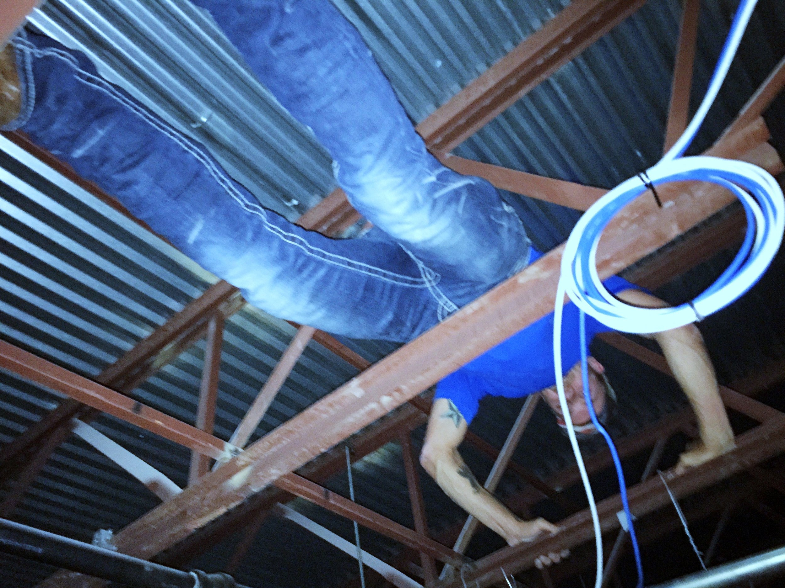 AV team technician running cable.