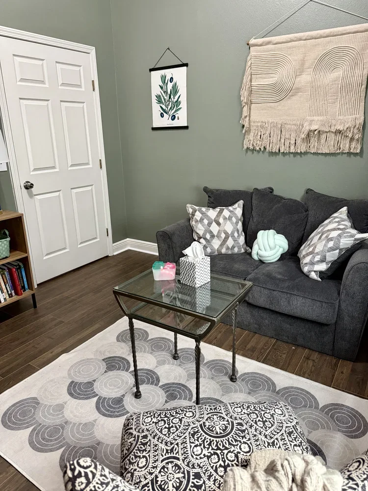 office suite commercial office space for rent curated boutique gray couch with gray rug green walls textile accents private rental