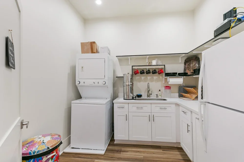shared kitchen boutique commercial private office space rental new orleans washer dryer laundry mugs sink cupboards fridge cooking