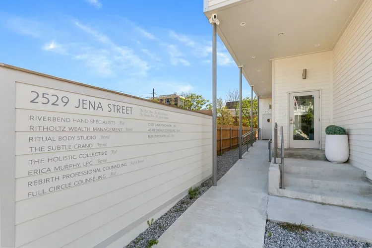 private boutique commercial office space signage wheelchair accessible ramp stairs entryway doorway ramp office names