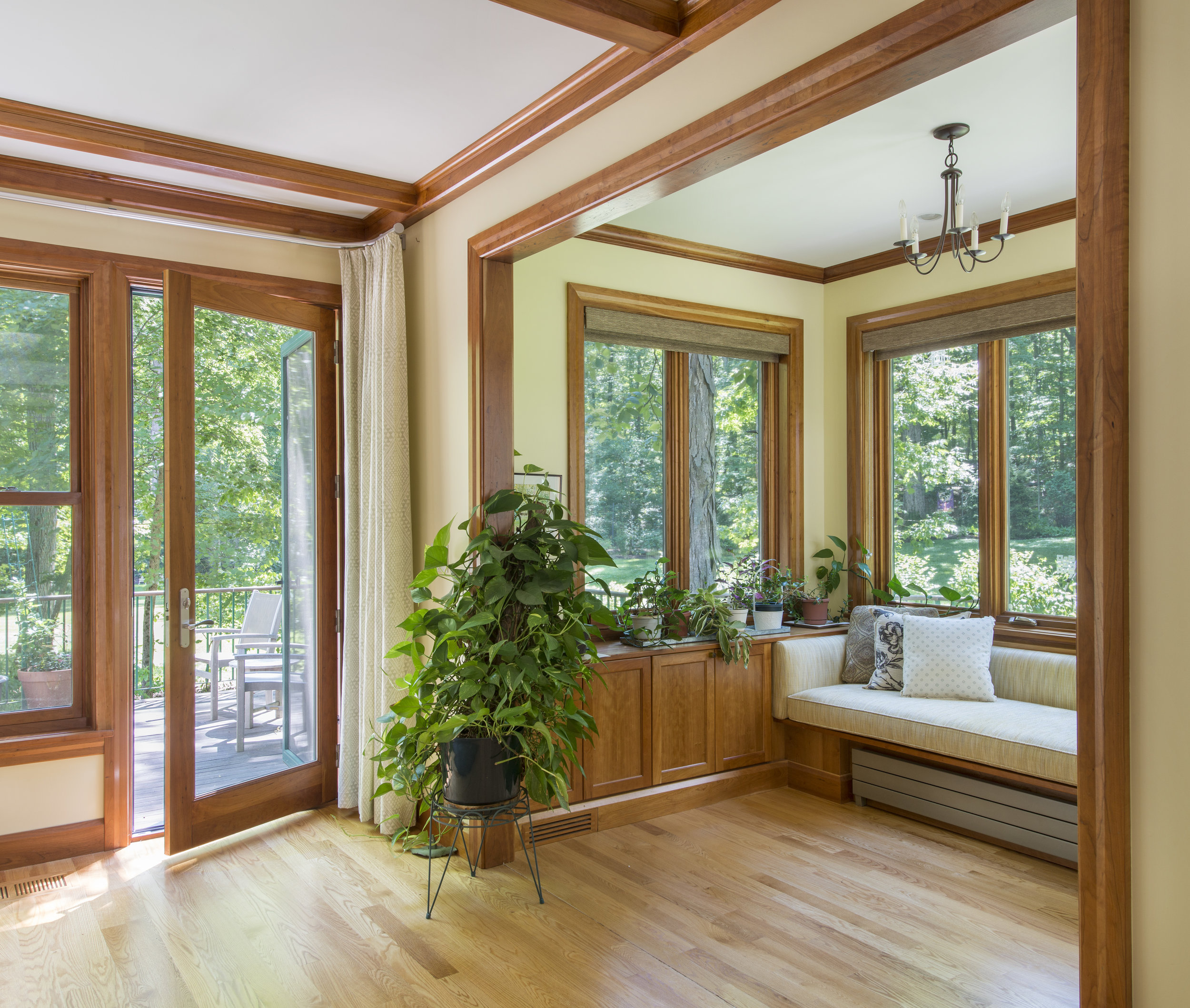Wood windows with custom built-in seat