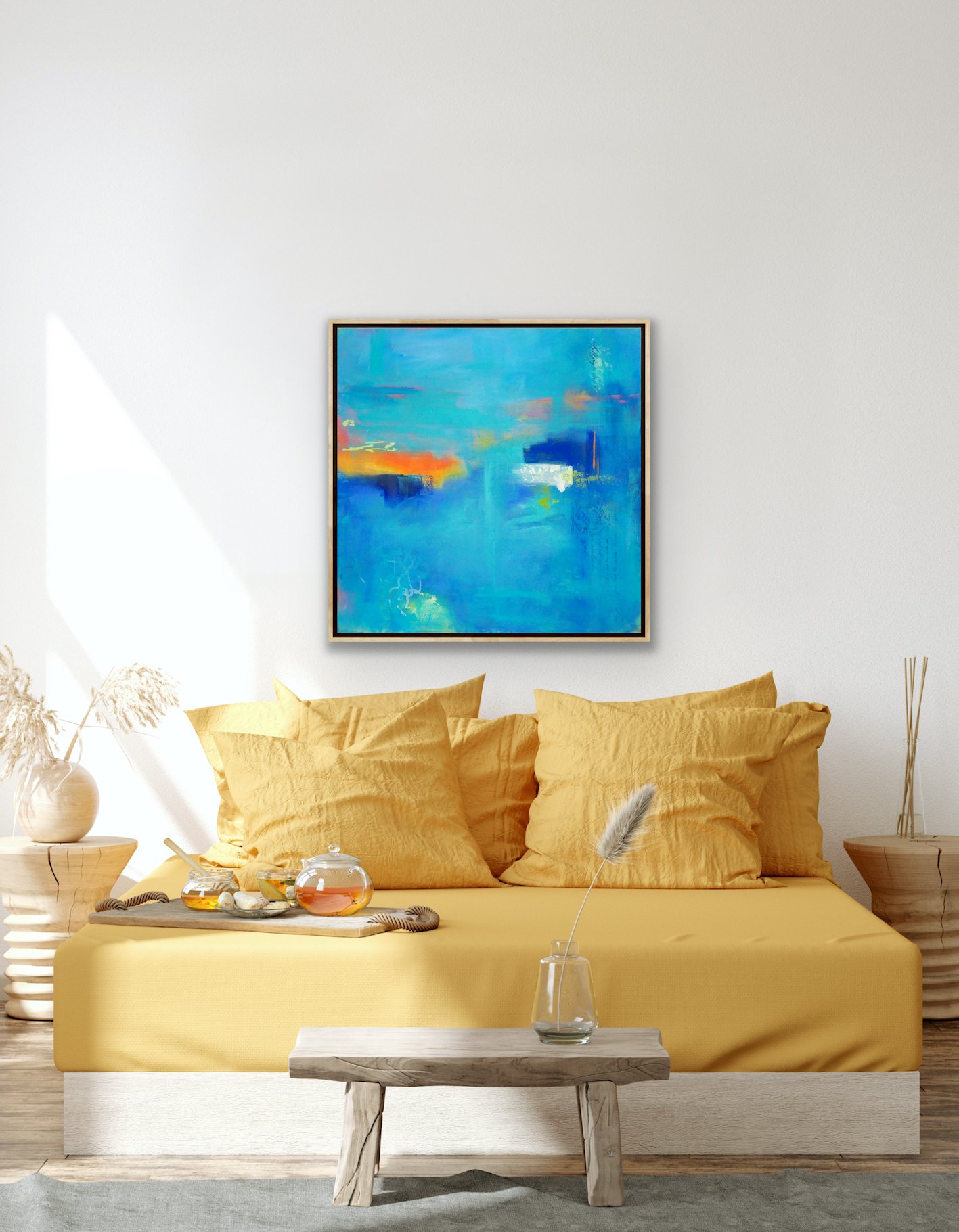 Acrylic abstract seascape painting in wood frame hanging on white wall above yellow bed