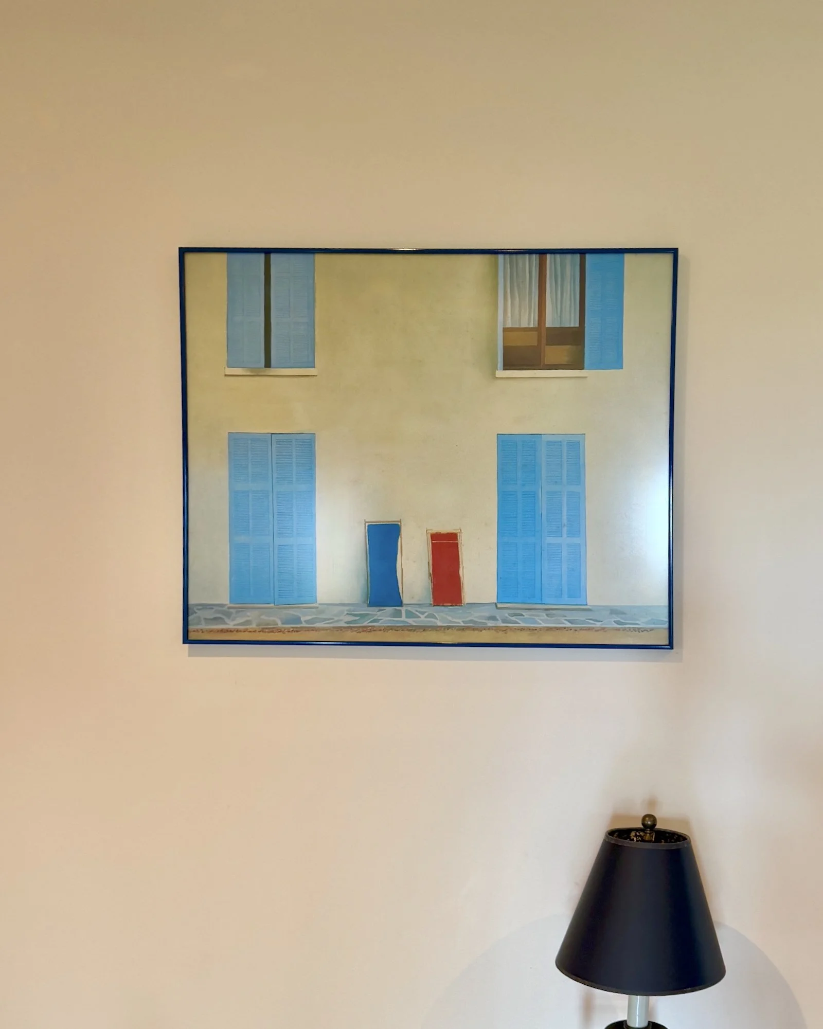 David Hockney 'Two deckchairs' print in balck frame on neutral wall