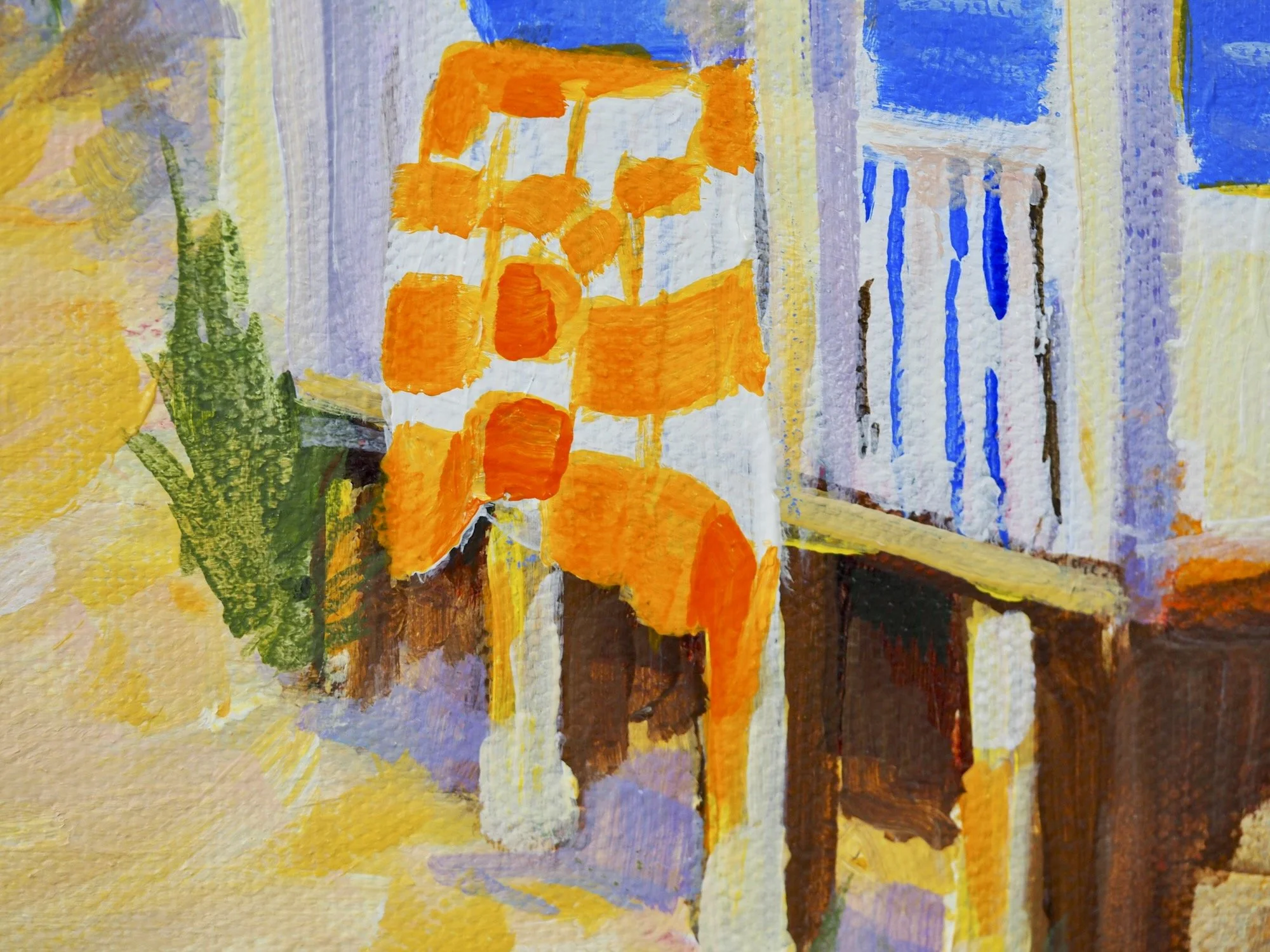 Detail of Blue Shutters, Bahamas showing an orange and white striped towel. hanging on fence.
