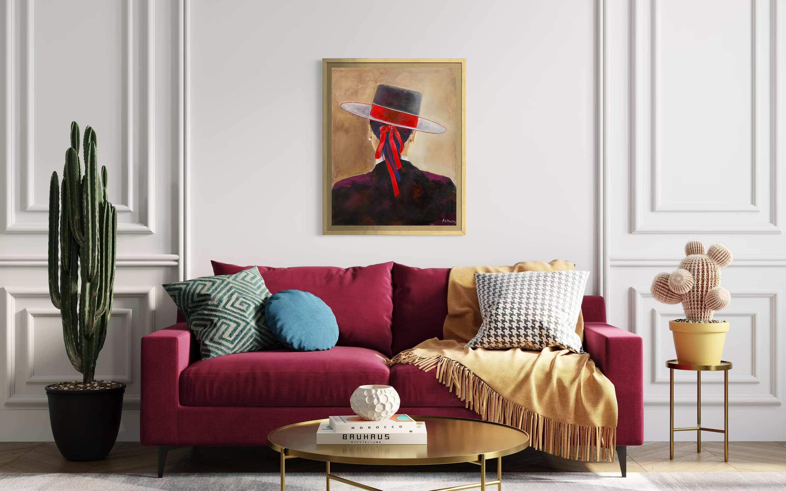 Amazona” by Anne Whately displayed above a rich raspberry sofa in a contemporary interior with colourful cushions and soft natural tone