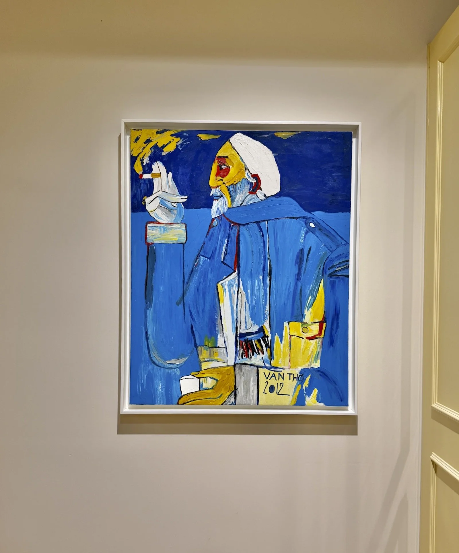 Van Tho original painting 2012 blue figure hung in hallway