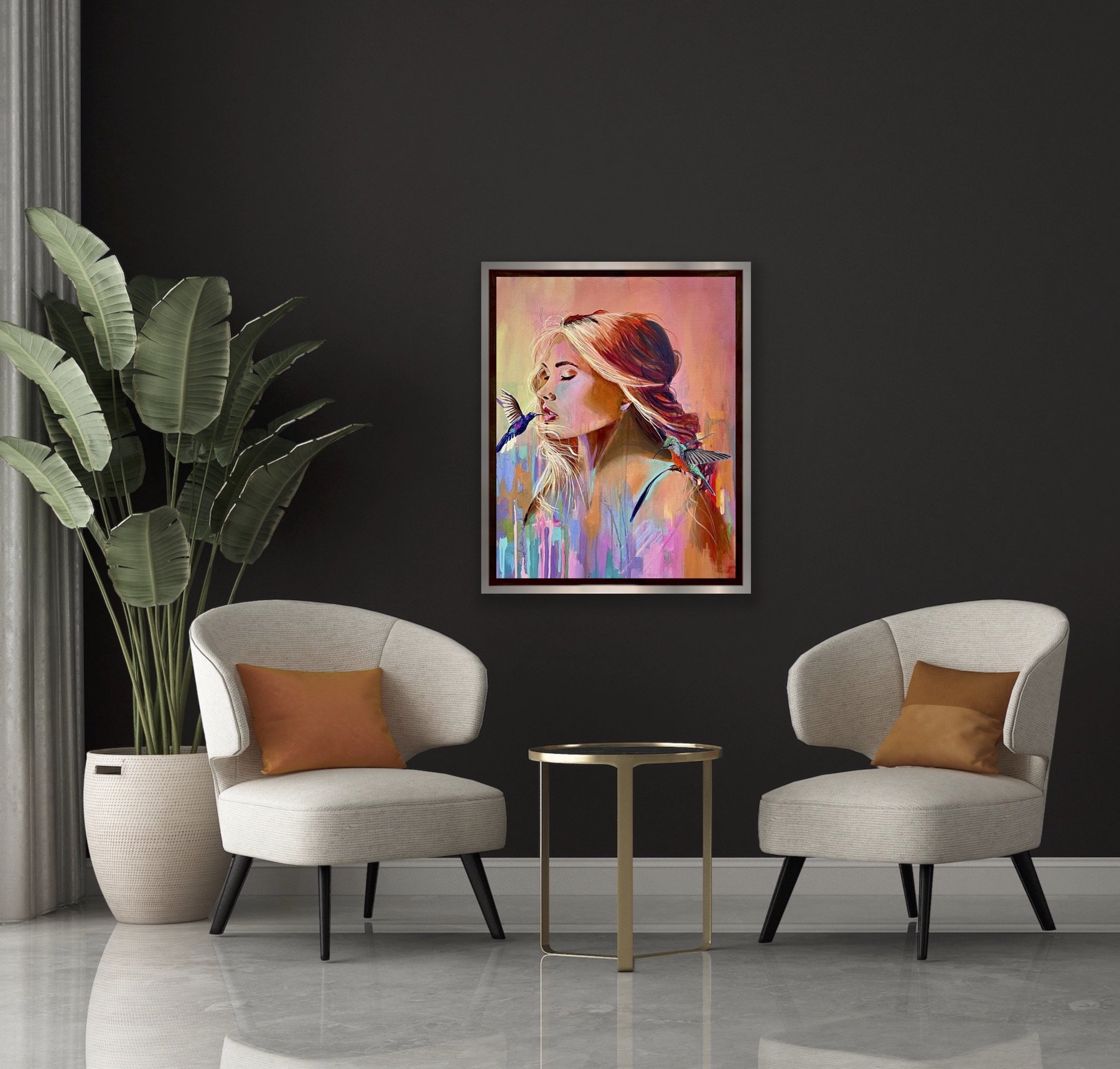 Colourful female portrait painting with hummingbirds displayed in modern dark interior with chairs