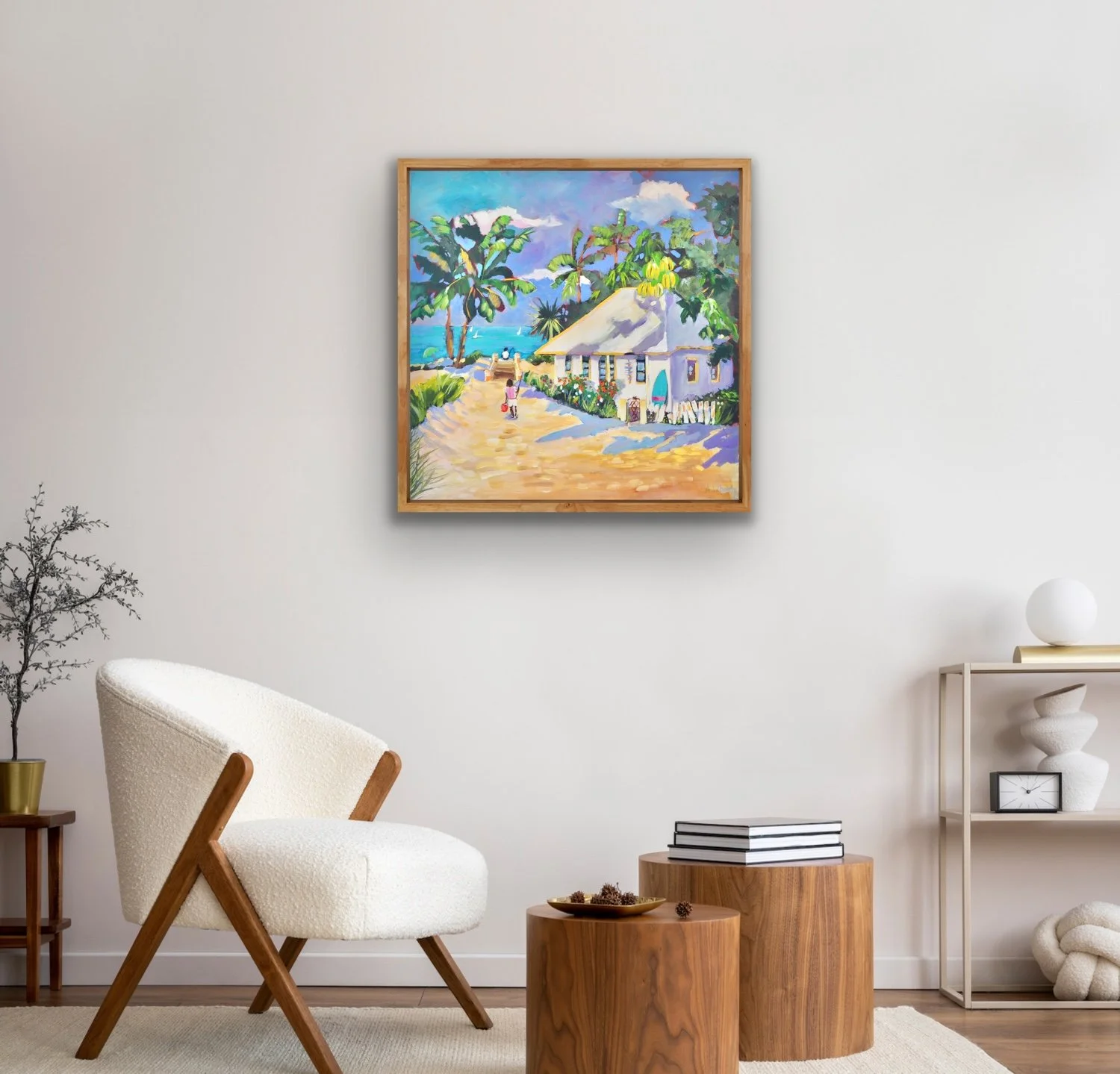 Sandy Track original artwork hanging in a modern living room with a white armchair"
