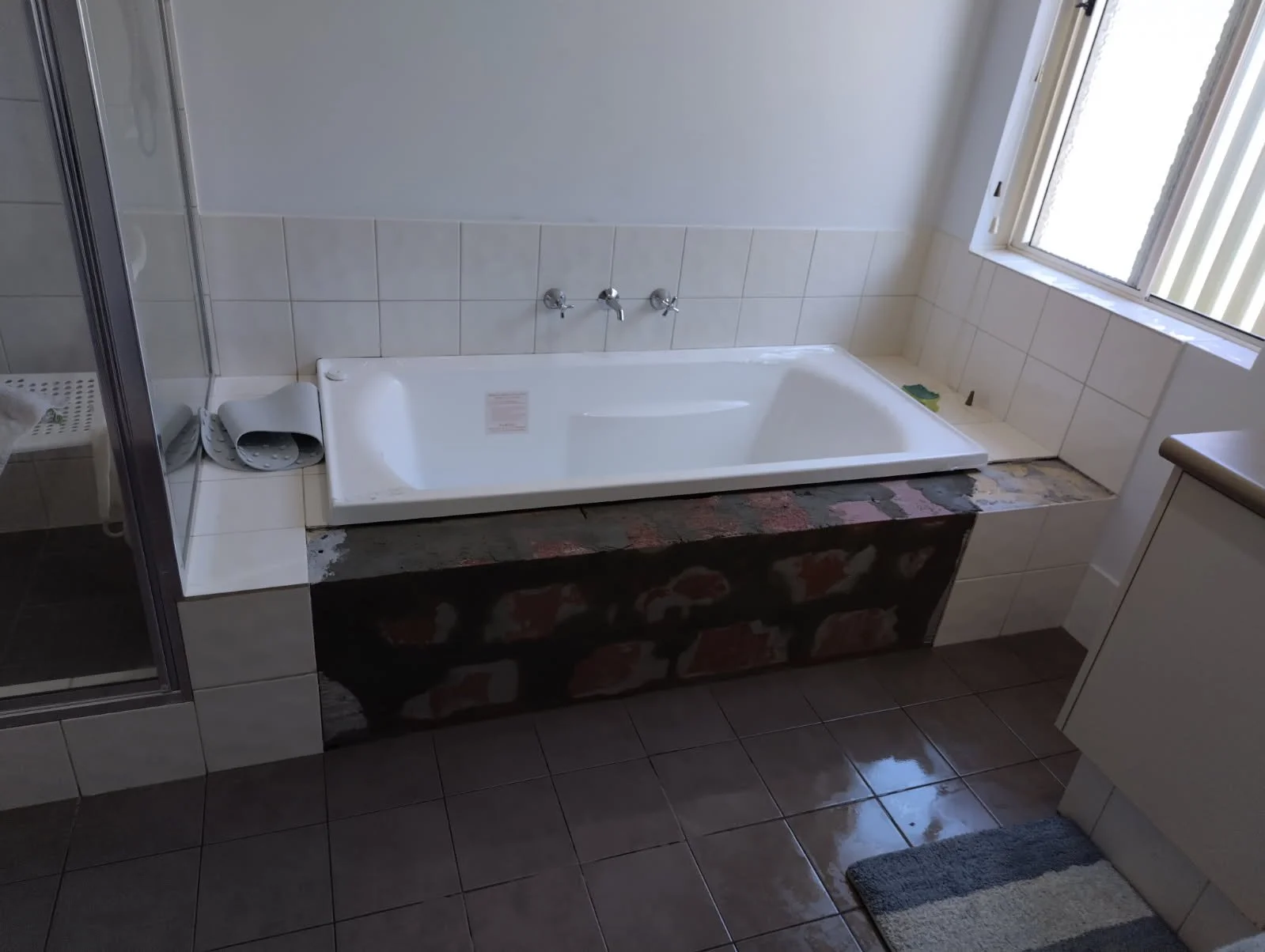 Bathroom requiring old tiles to be matched without a full retile.