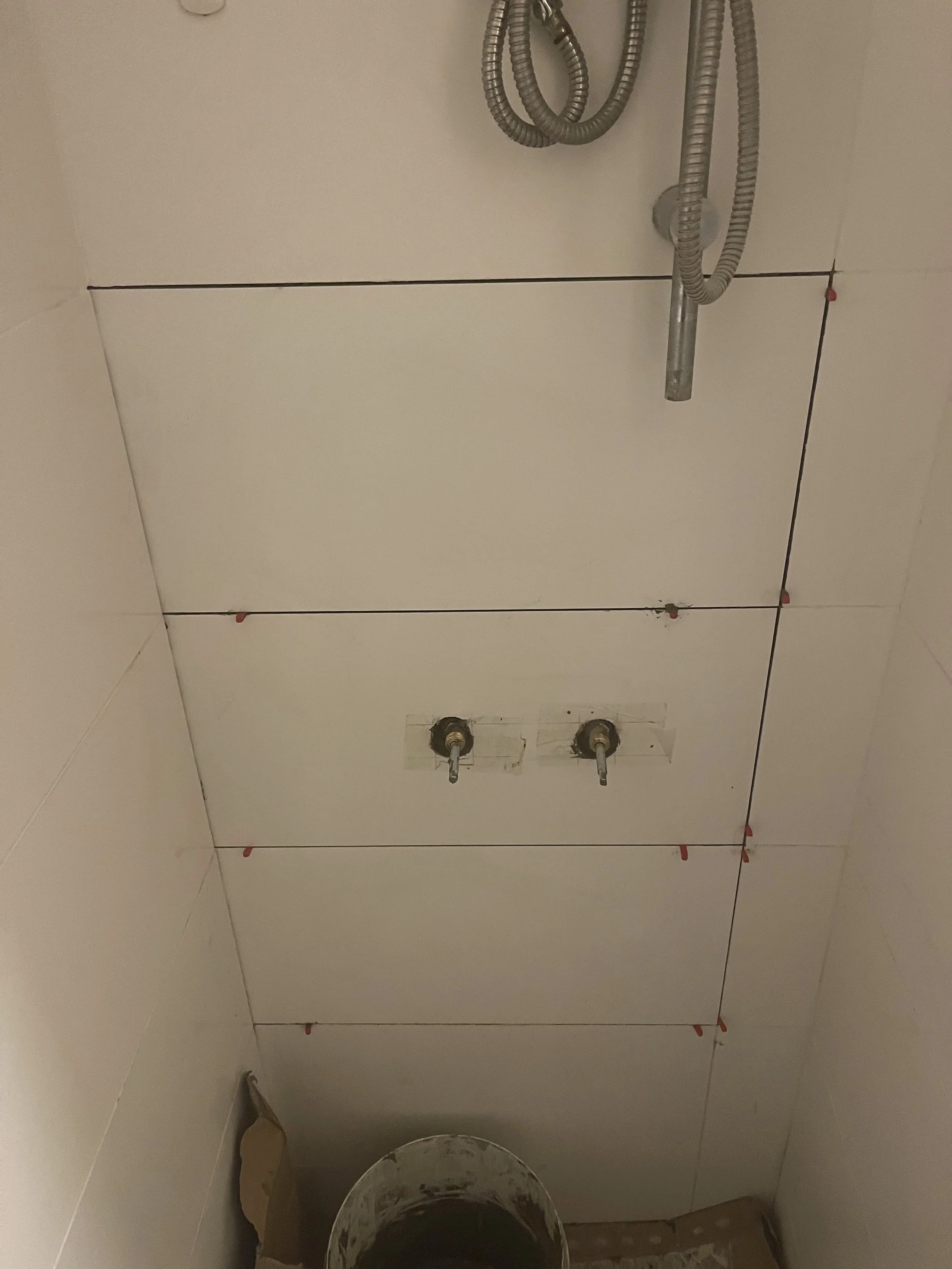 Bathroom fitting with discontinued tiles matched by the tile library