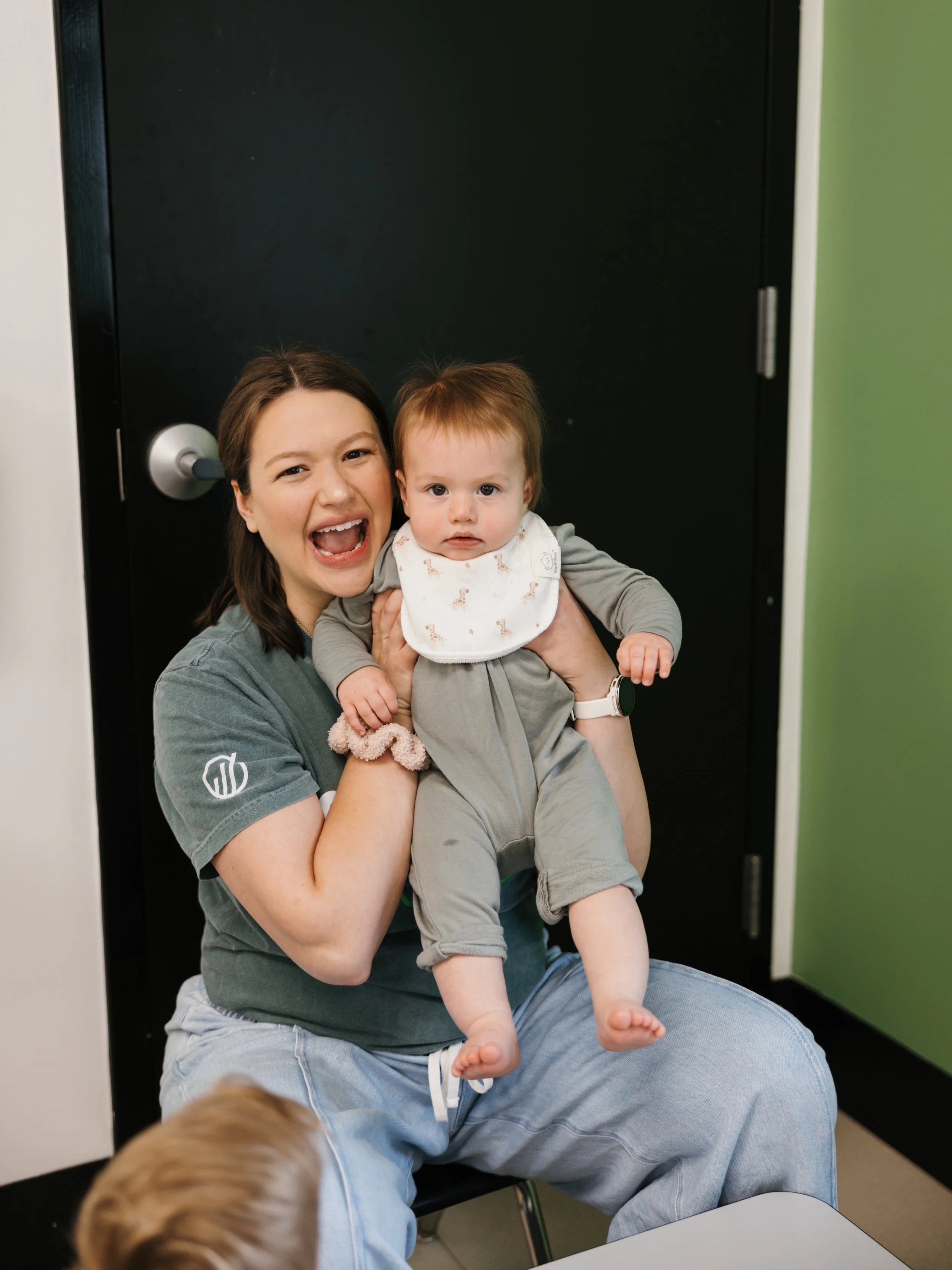 A woman serving with the babies at onward community church in frisco