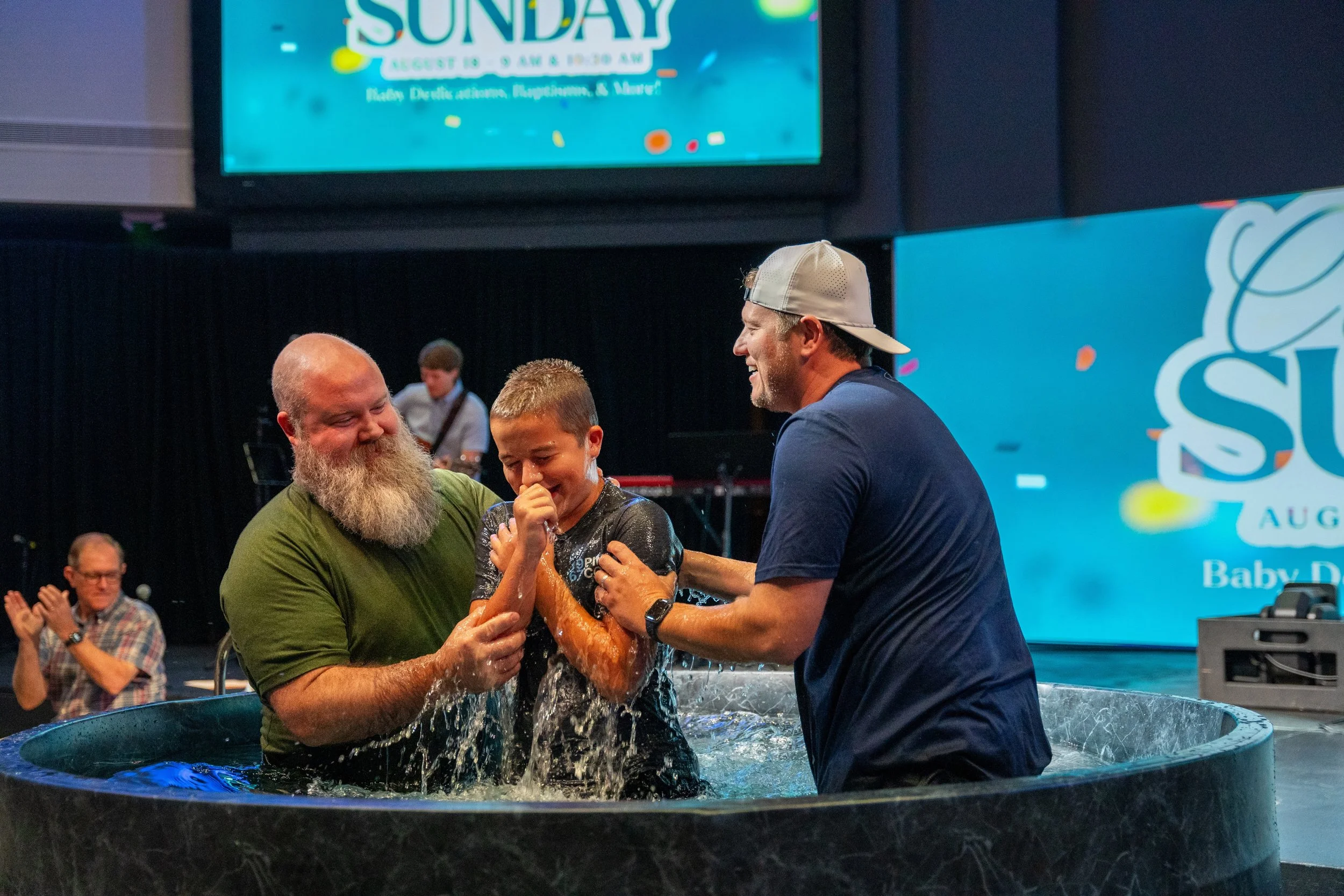Student being baptized during service at onward community church