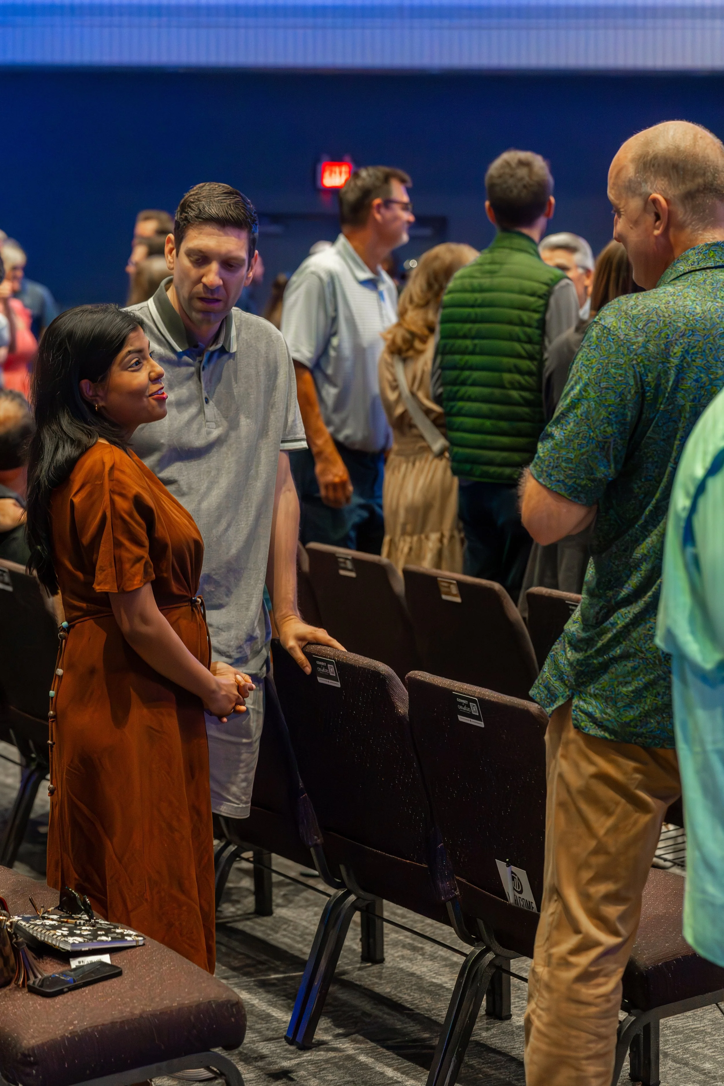 Couples talking during meet and greet at onward community church