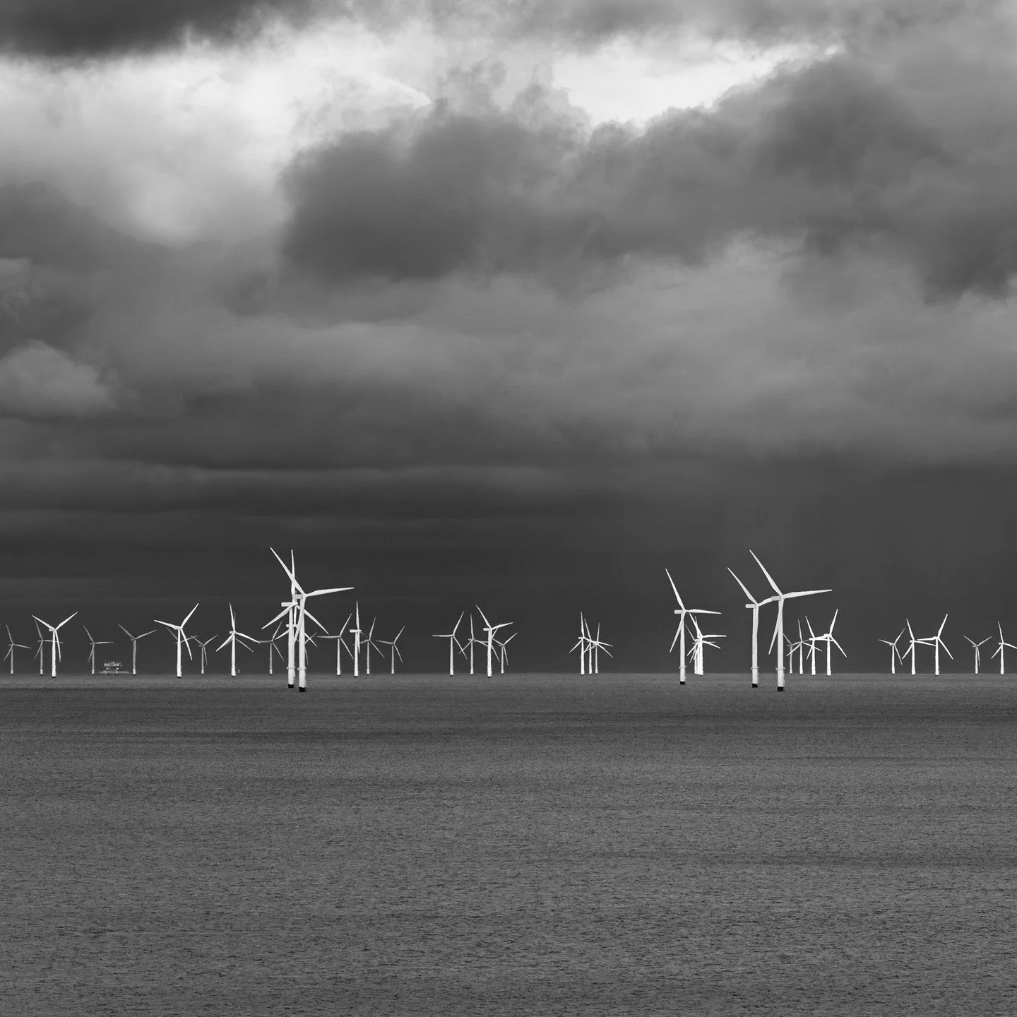 &quot;The answer my friend, is blowin' in the wind, the answer is blowin' in the wind.&quot; - Bob Dylan

Day 336 - View of offshore windfarm from Penrhyn Bay coastline

#northwales #northwalescoast #northwalesphotography #blackwhitephotography #blac