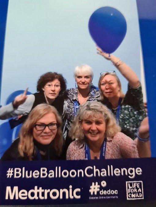 Alex Haggett and other #dedoc° voices diabetes advocates attending EASD 2023 in Hamburg scientific conference blue balloon challenge medtronic.jpg