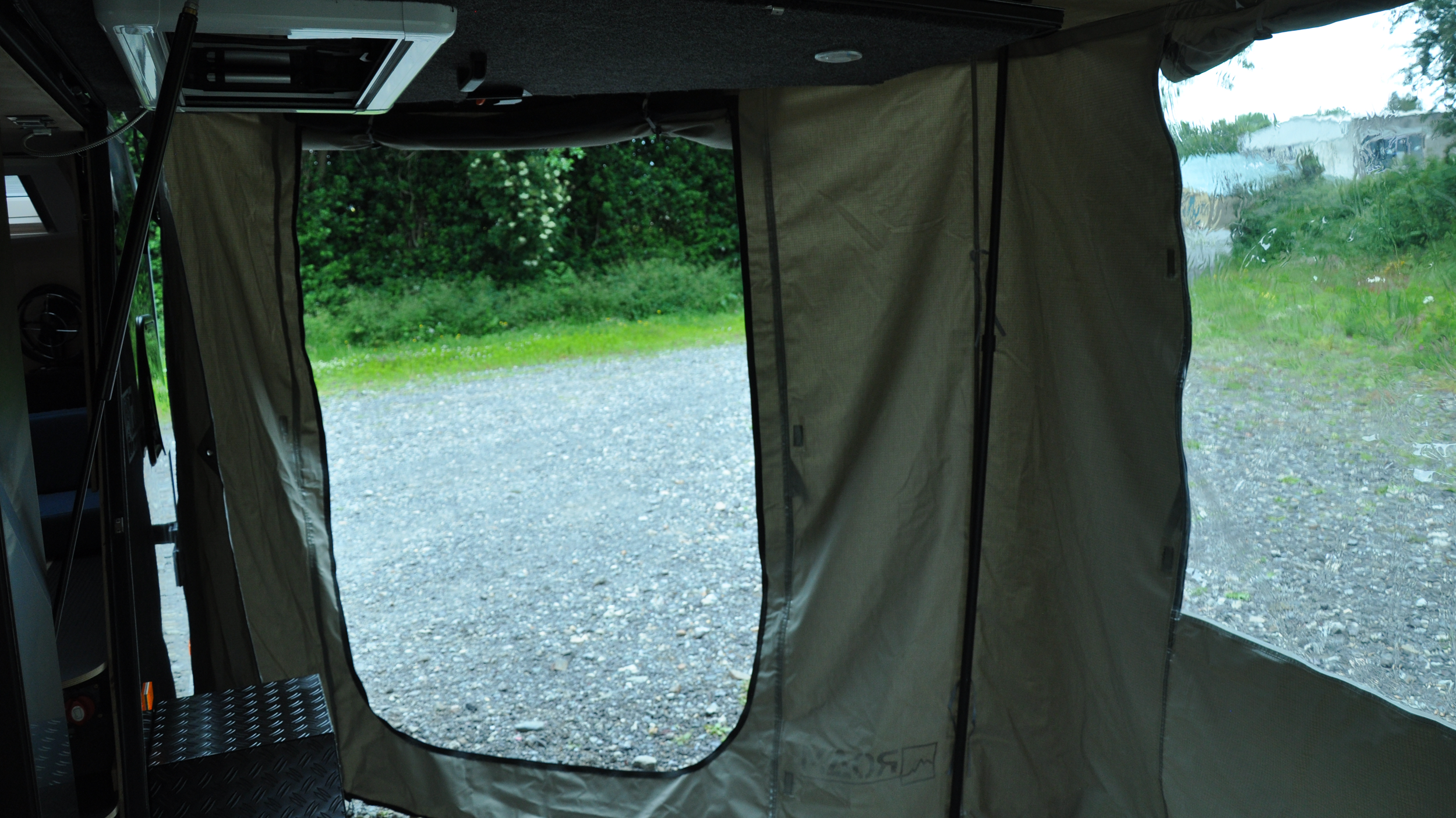 Landscape-Awning-Door-Close-Up-Unzipped.png