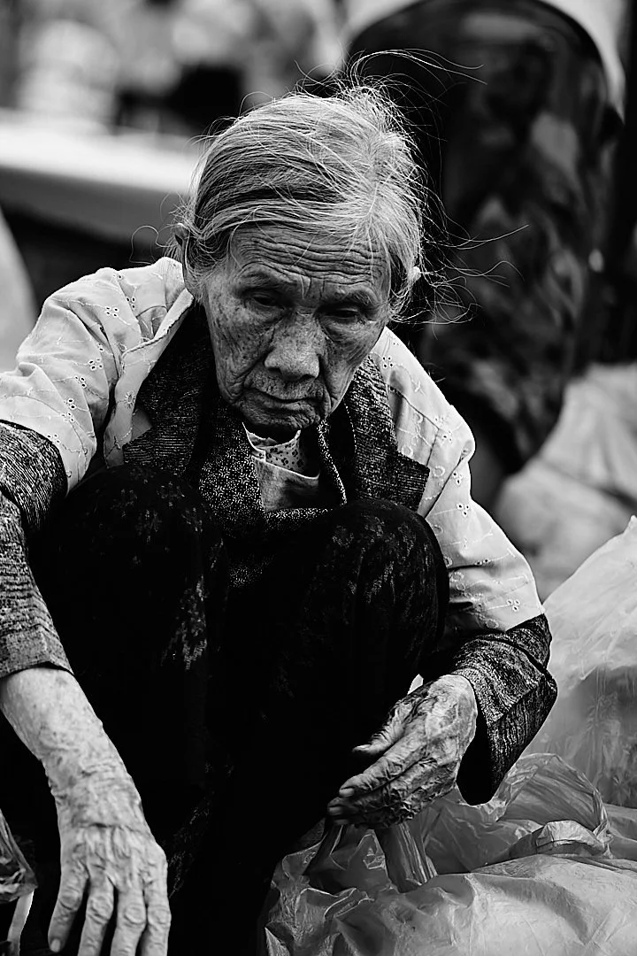 She bent over her work with the patience of someone who has been doing this for fifty years and expects to do it for fifty more. Her hands knew exactly what they were doing. They did not need her to watch.