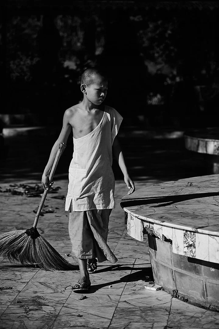 He swept slowly and without distraction, the broom moving in long arcs across the stone. He was not in a hurry. The leaves were not going anywhere.