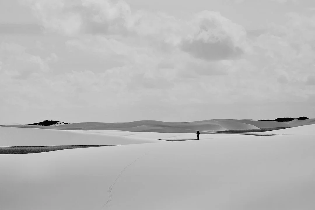 I left Travosa the way most people leave small places on foot first, then by road, then by distance. The man in the white shirt was still walking when I turned to look back. The dunes swallowed him slowly, the way they swallow everything eventually. 