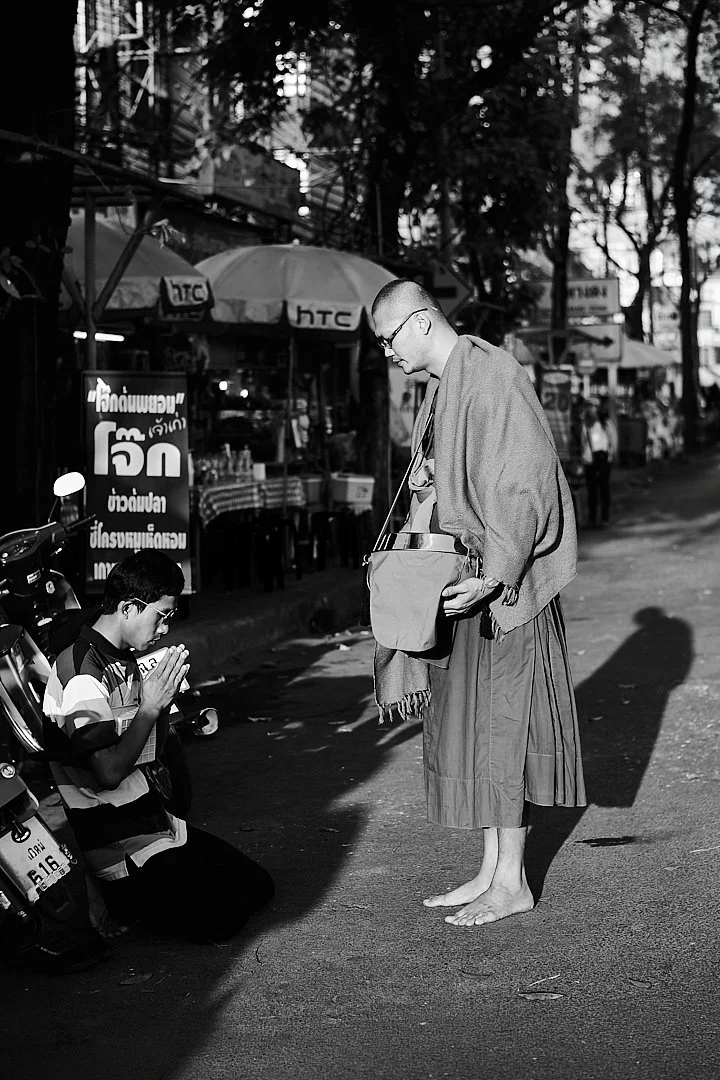 Before starting his day the driver pulled his motorcycle to the side of the road, got off, and knelt. The monk bowed. The whole exchange lasted less than a minute. It was the most important thing either of them did that morning.