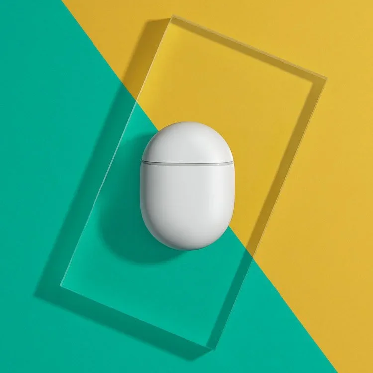 google pixel ear buds on colorful green and yellow background