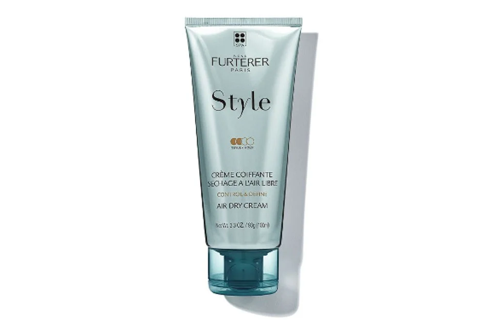 A tube of hair care product labeled 'Furterer Paris Style Air Dry Cream' with white and teal packaging.