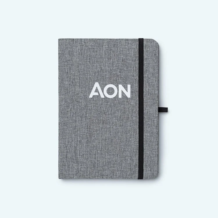 Gray notebook with AON logo and black elastic band on a white background.