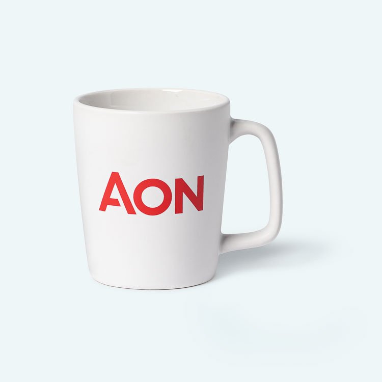 White mug with red "AON" logo on a light background.