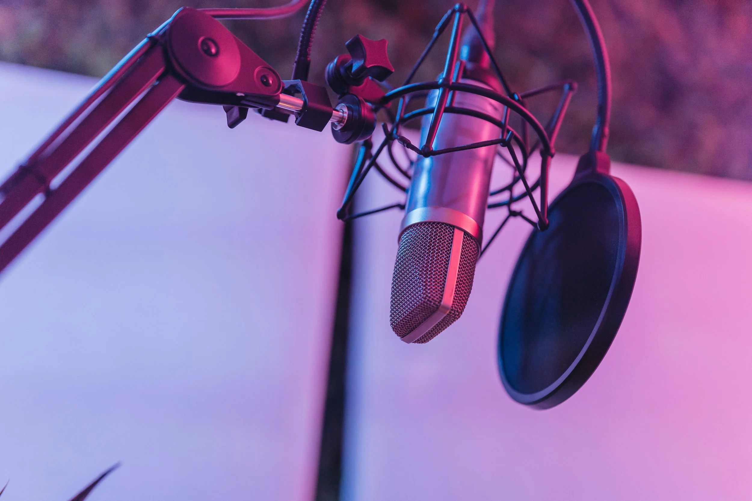 image of a microphone with purple lighting