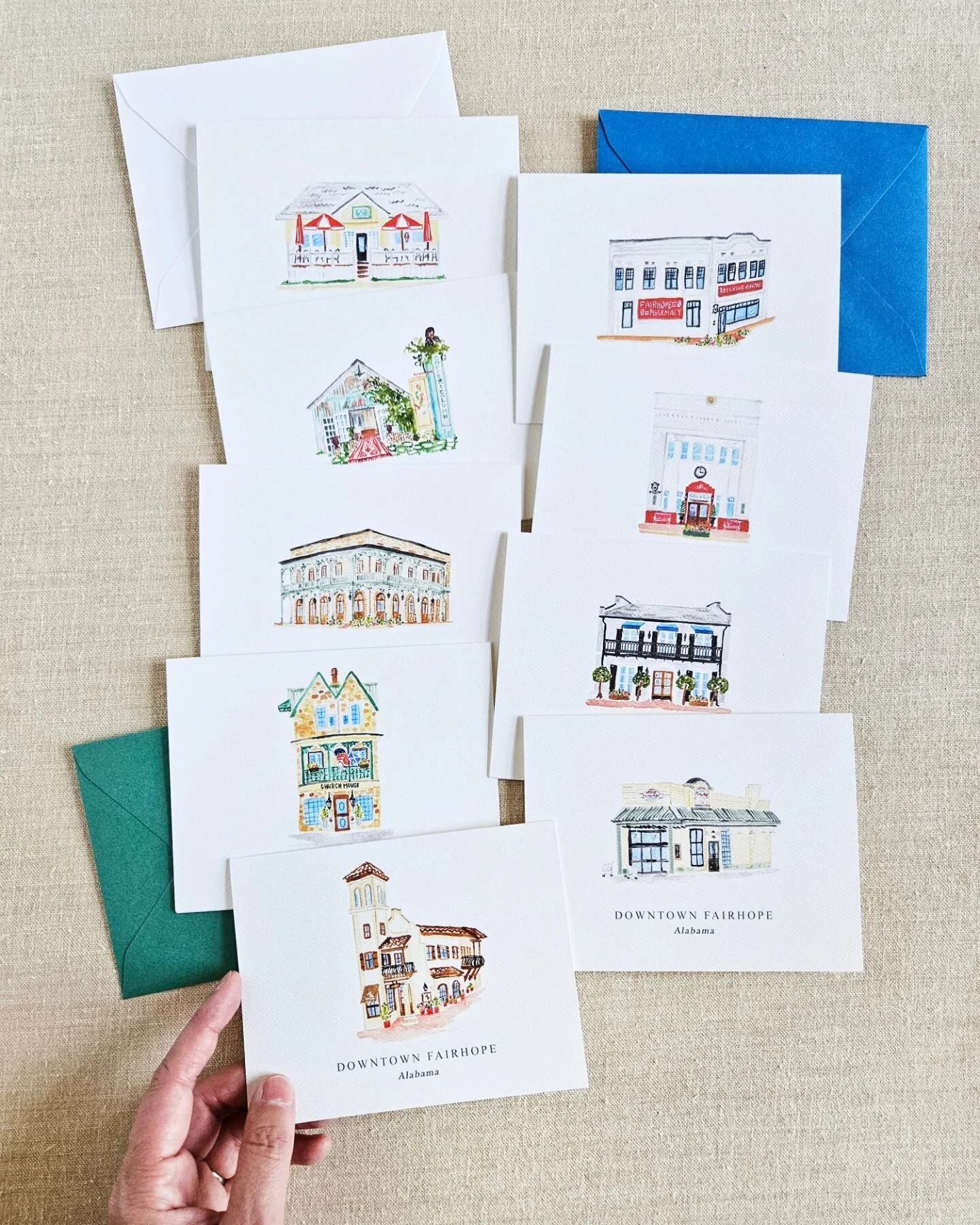 The 9 different watercolor illustrations in our Downtown Fairhope note card set, along with a fresh vibrant mix of envelopes. This everyday item can be used throughout the year! 💓
.
.
#fairhopeedition #Fairhope #Fairhopeart #Fairhopeartist #art #art