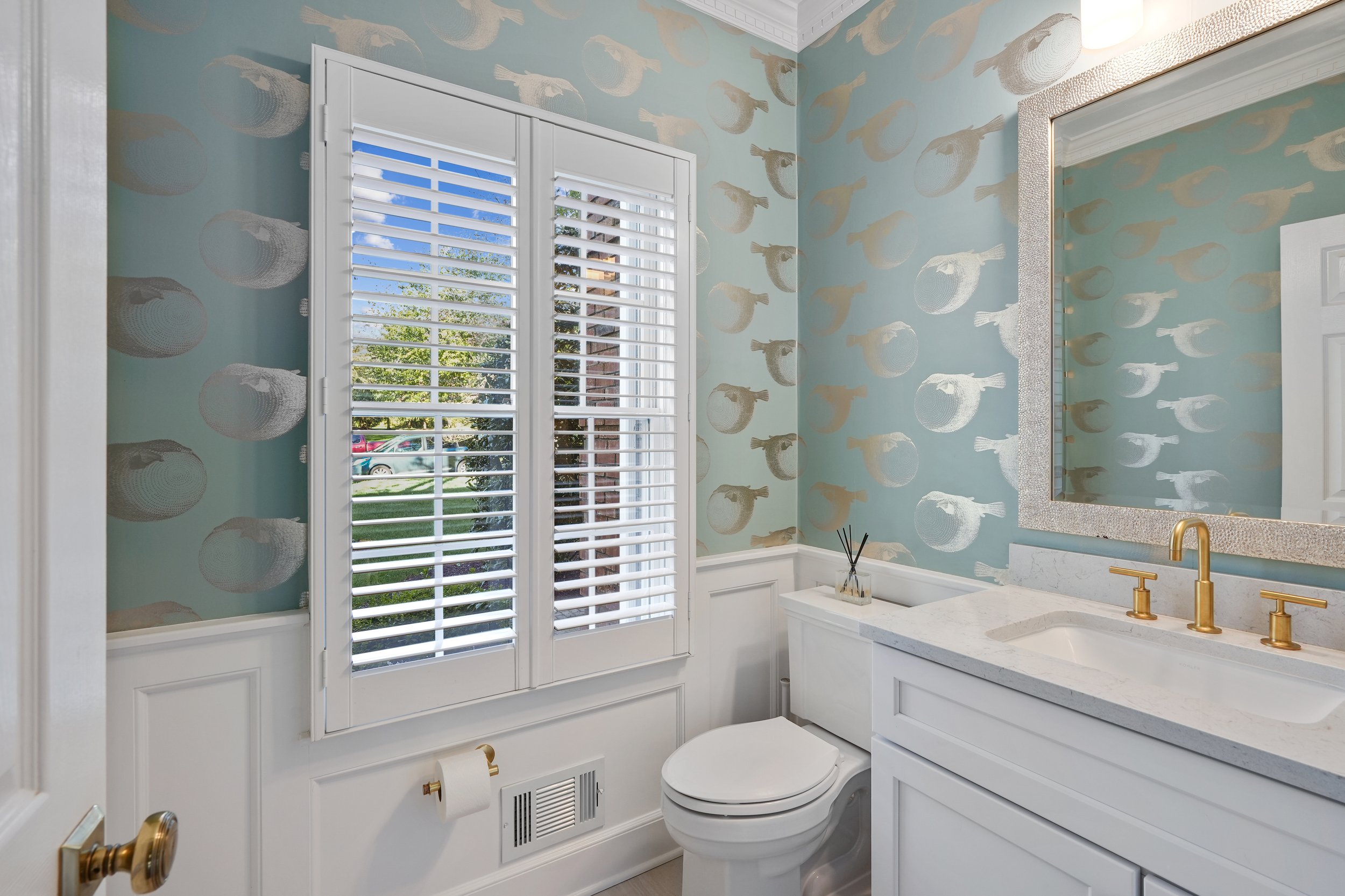 Primary bathroom, double under mount sink, glass shower, soaking tub, mudroom, laundry room, charcoal floor tiles, galley bathroom, light and airy.