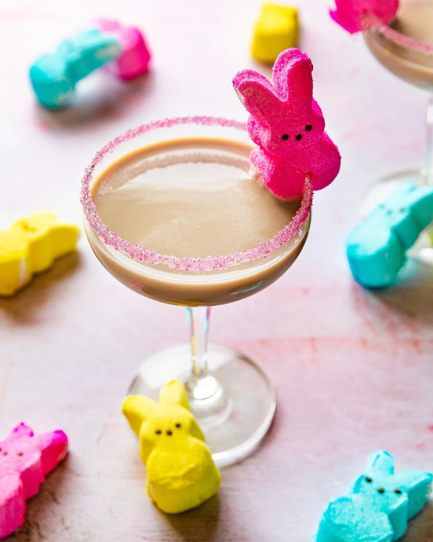 Bunny season in full effect 🐰

Strawberry 🍓 Mudslide recipe: 

1 oz. @oceanvodka 
1 oz. @kahlua 
1 oz. @baileysofficial Strawberries and Cream 🍓 
1 oz. Heavy Cream
Pink Sprinkles for the glass rim
1 @peepsbrand (or more) for garnish 

*photo credi