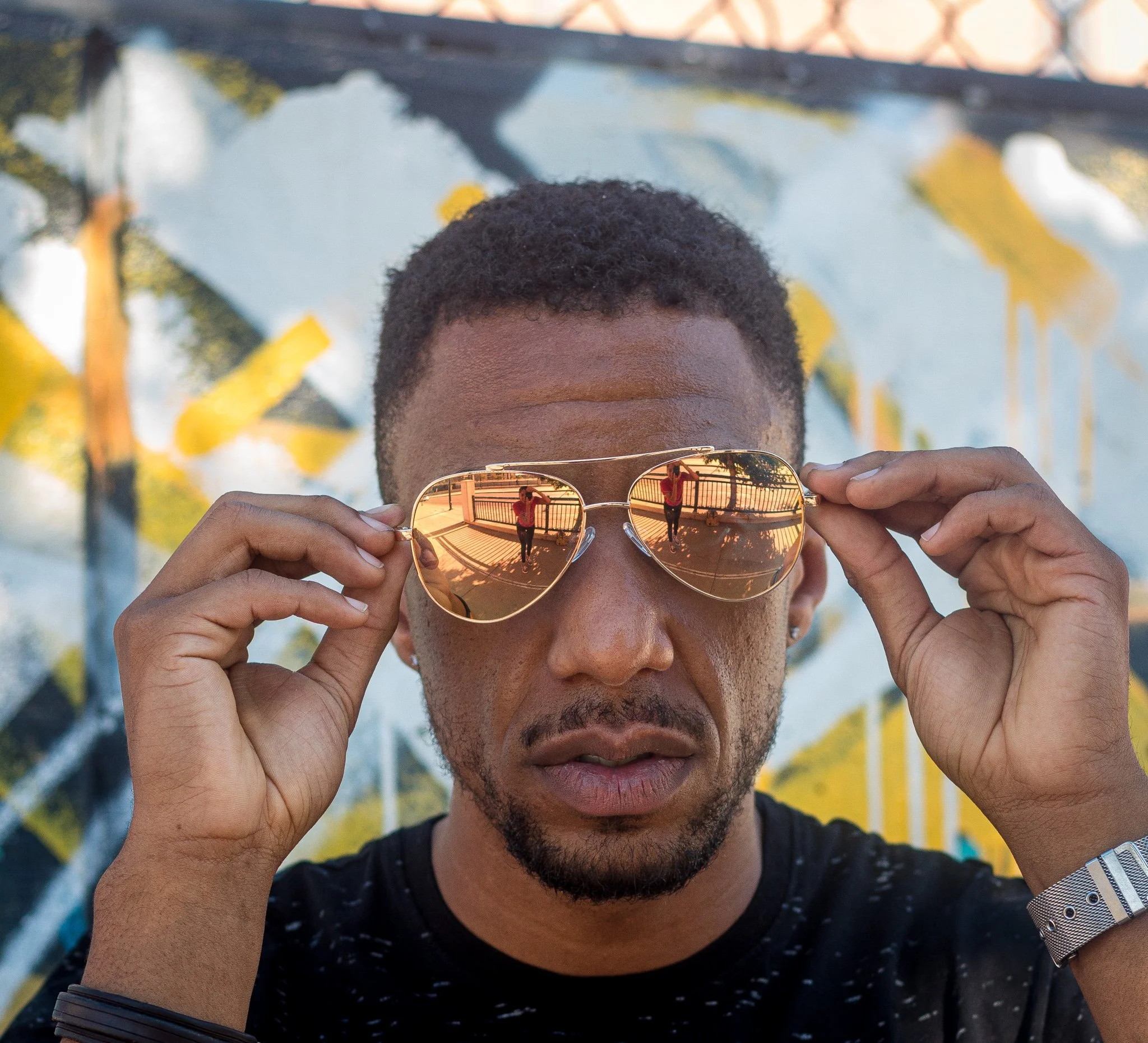 Copper-toned shades to compliment urban headshot.