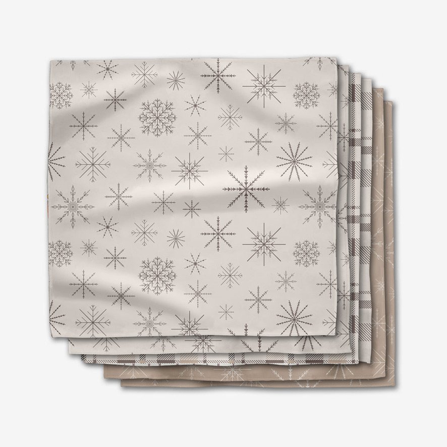 Geometry House winter dinner napkin set featuring minimalist snowflake and perfectly plaid patterns