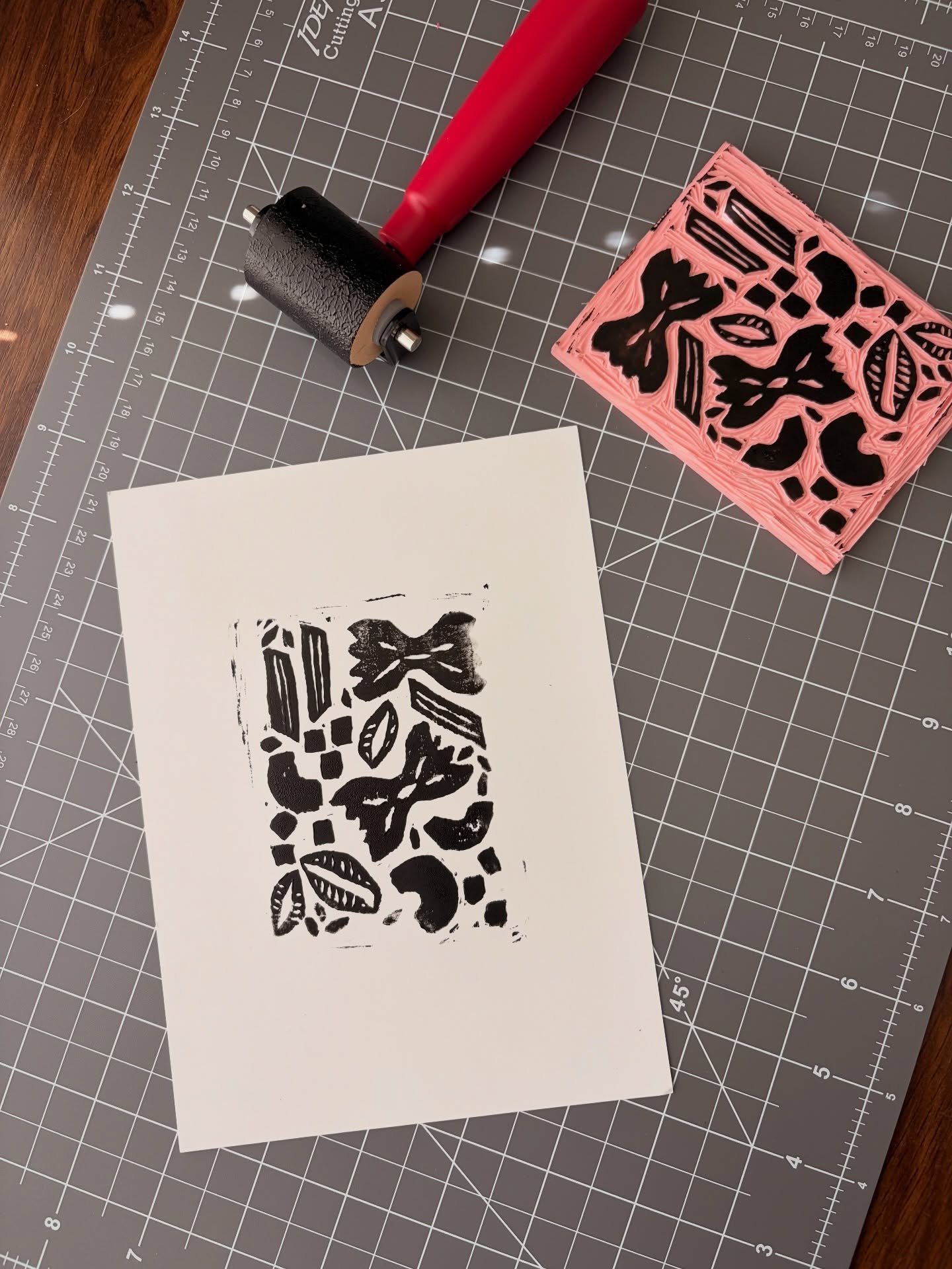 First Lino ink block print done!

Loved the mess, loved the imperfections in the print, definitely have some notes to make it better. 

What do you think? Do you like the original digital illustration or the block print better?