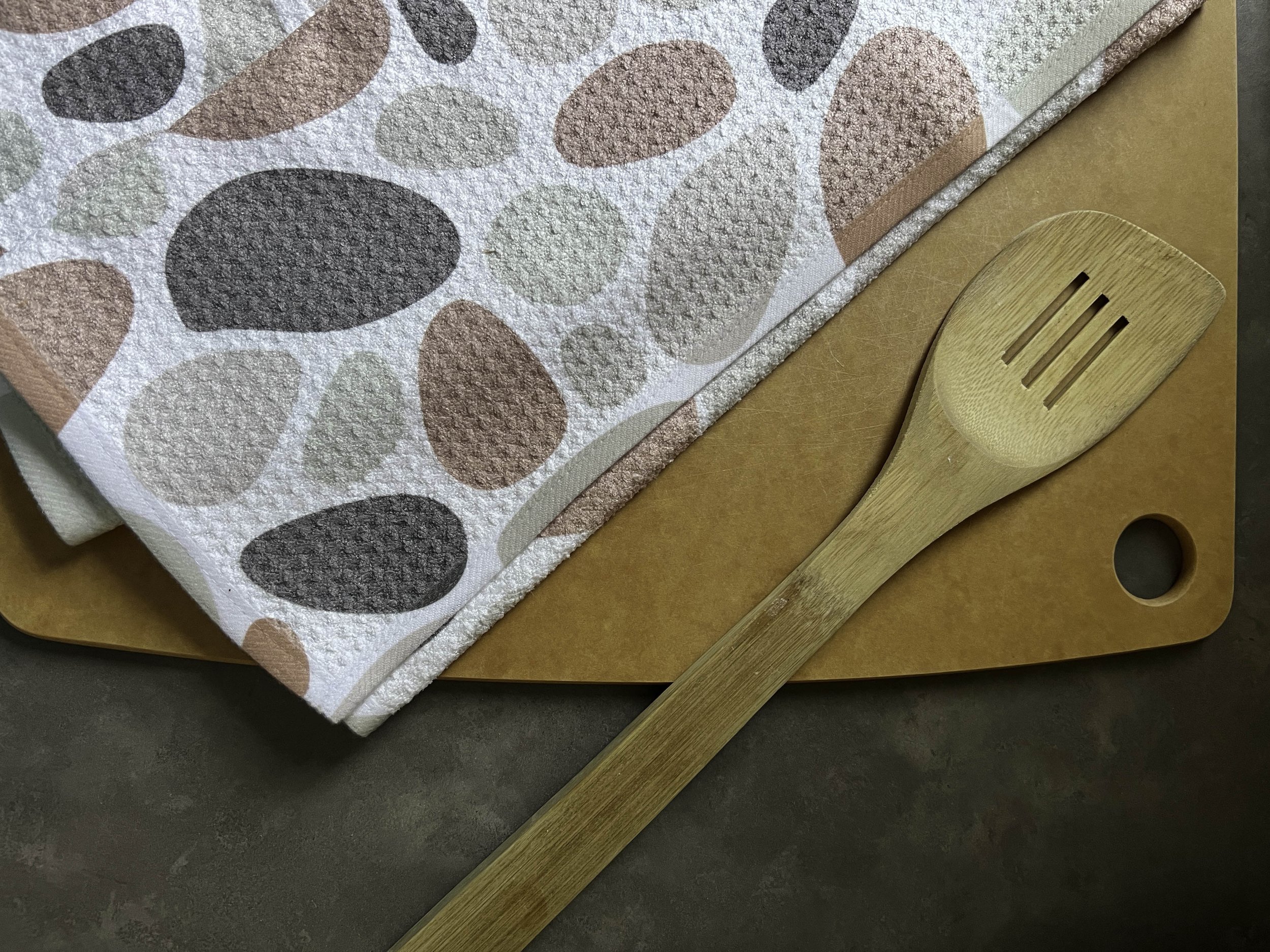 Geometry House tea towel on a cutting board