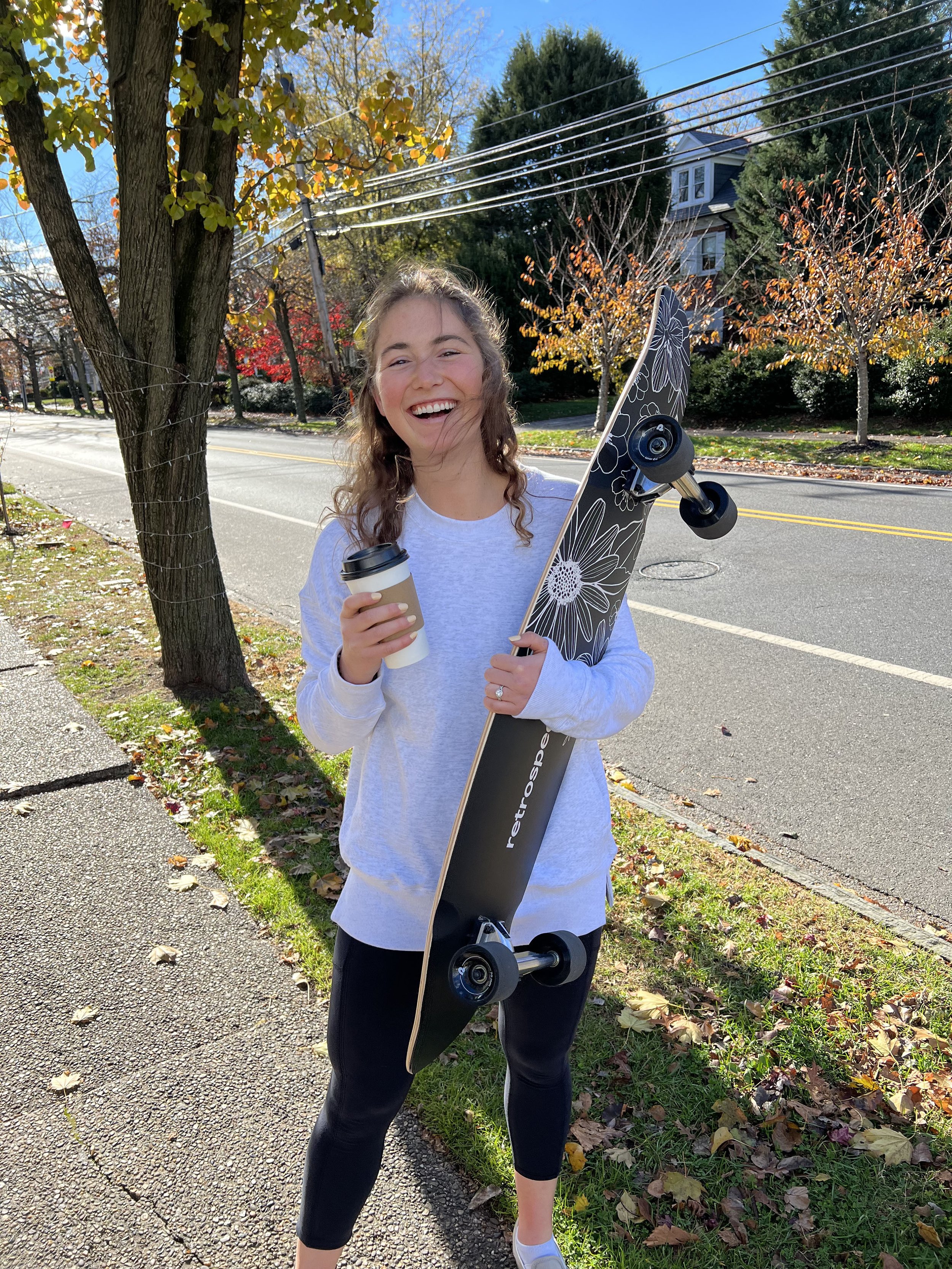 Rosa Veliky holding her Retropec Zed longboard design