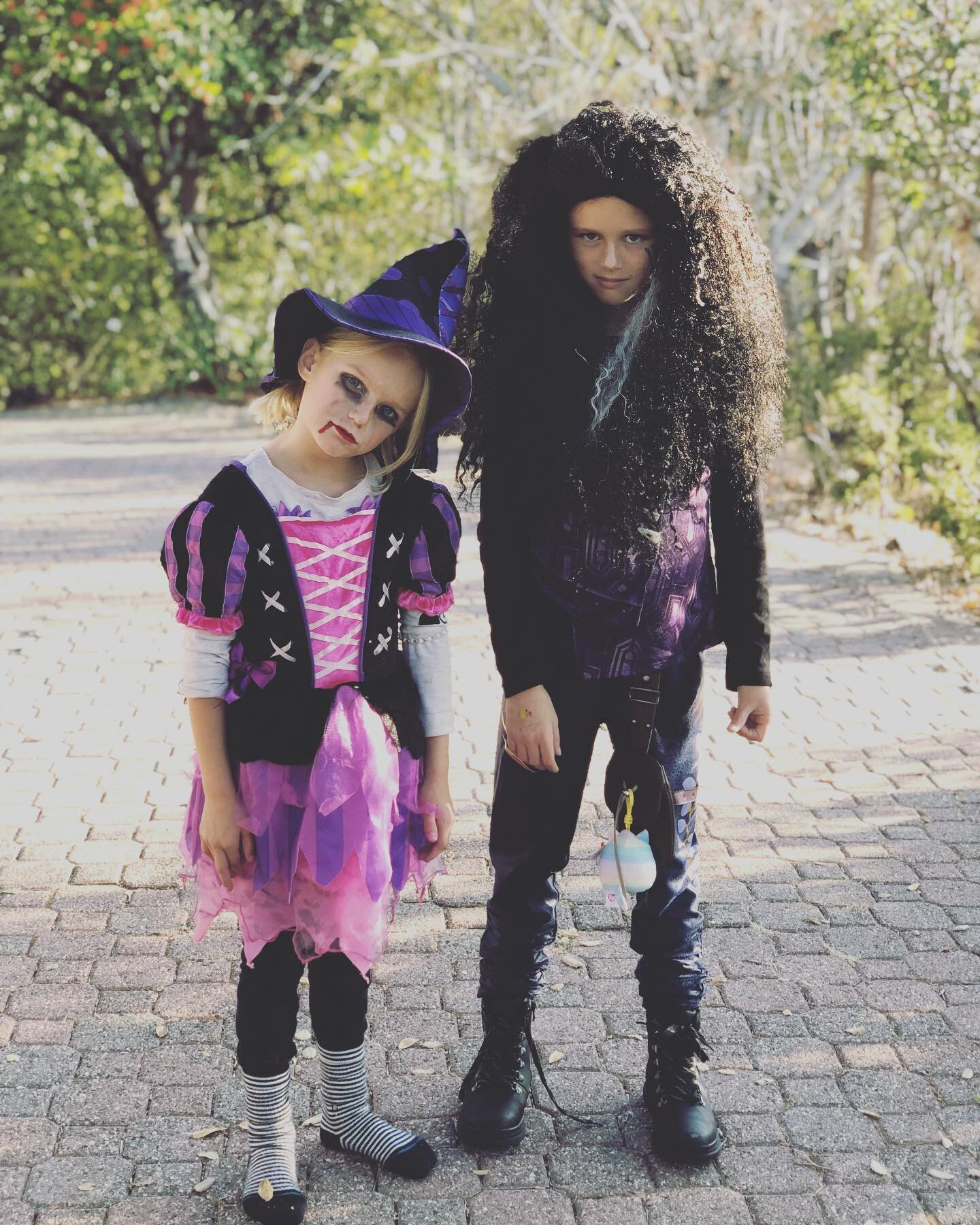 I find this mostly awesome and kind of terrifying, too. Especially the one on the left, who did her own makeup and knew to tilt her head and make her face like that. Kids are hilarious. Even extra when in costume. 
.
.
.
Happy Halloween! 🎃🎃🎃