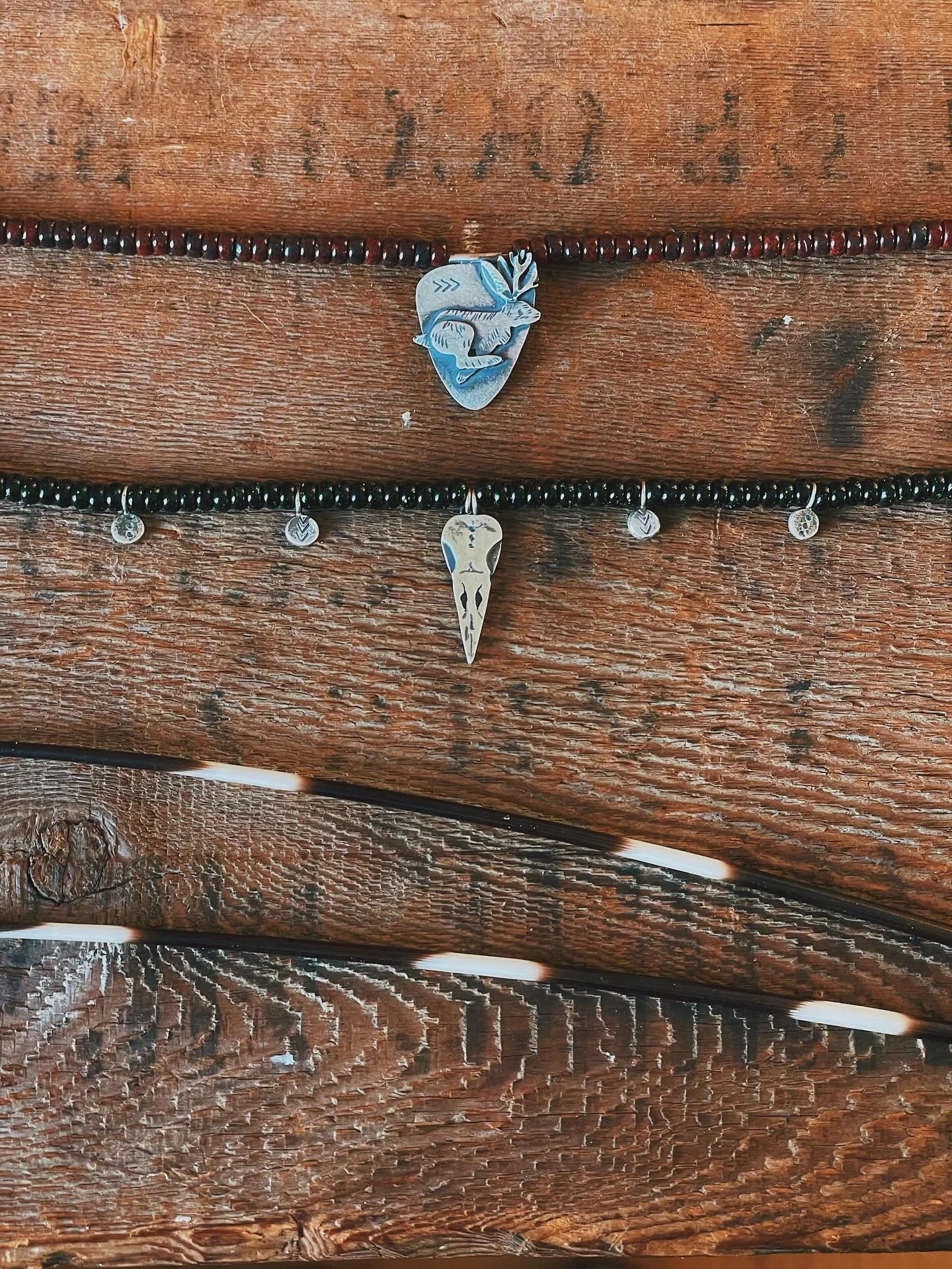 A couple more offerings for Tuesday&rsquo;s update.

The first is steeped in North American folklore &bull; a sterling jackalope on the run. Paired with a 16&rdquo; string of Poppy Jasper beads. 

The second, a Raven skull &bull; Symbolizing intellig