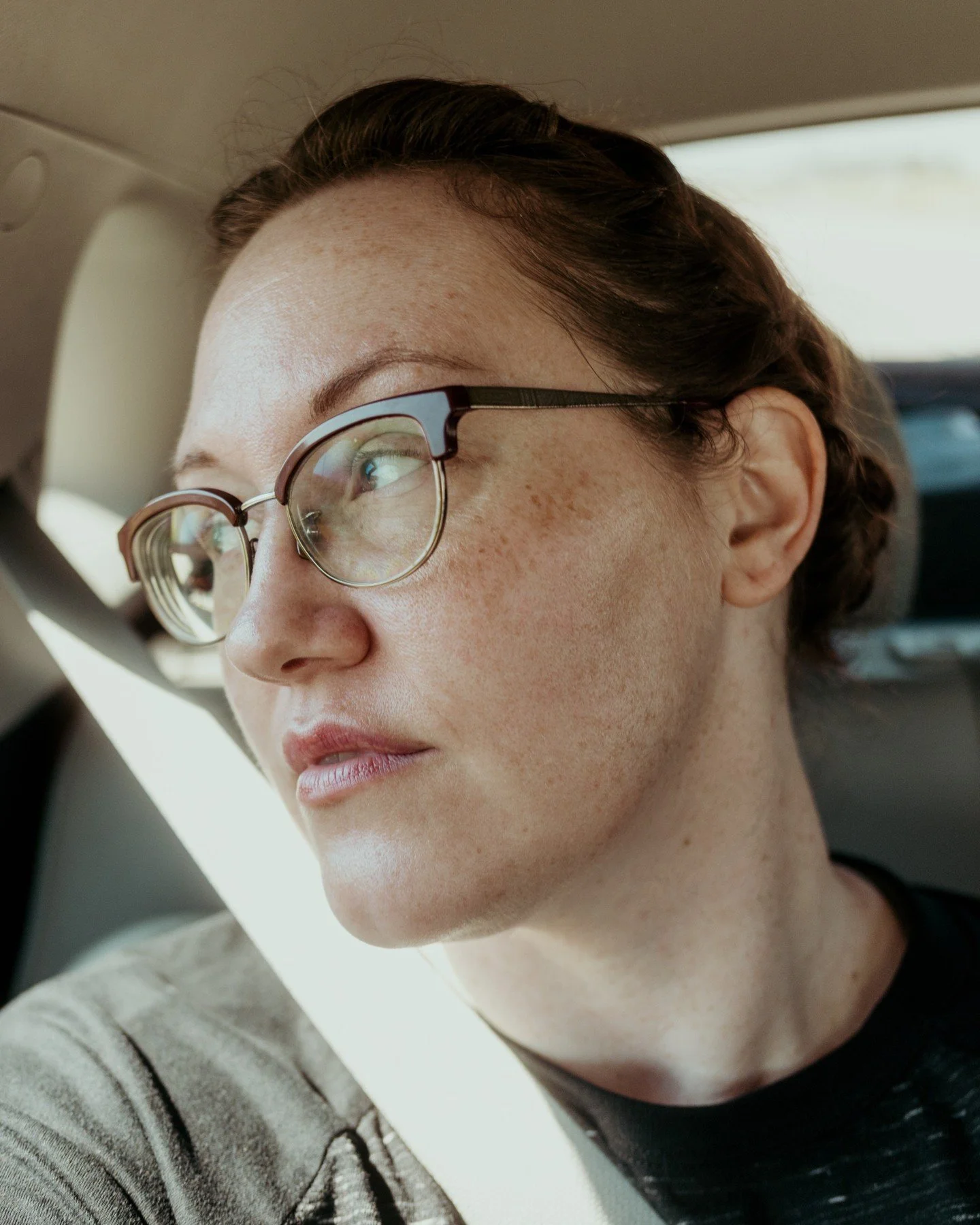 💖 I love myself enough to be in the photo, and you can too. 💖
.
.
.
.
.
[Image Description: Sam, a white woman with freckles &amp; glasses and hair up in braids is in a car with a seatbelt on, looking out the window. It is clearly sunny outside, th