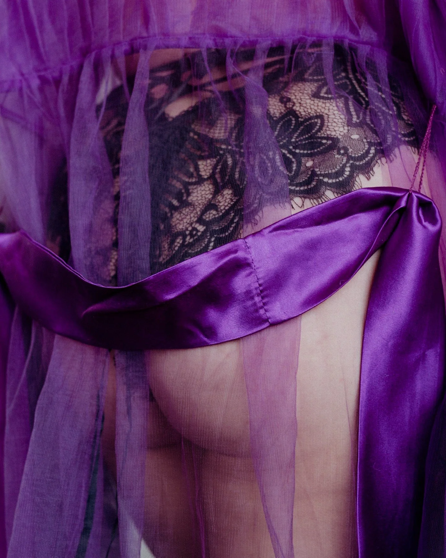 Your boudoir + empowerment session doesn't have to focus on sexy vibes, but if you want it to? I've still got you covered 😘
.
.
.
.
.
.
[Image Description: A close-up image of a white woman's butt, seen through a sheer purple robe. The woman is wear