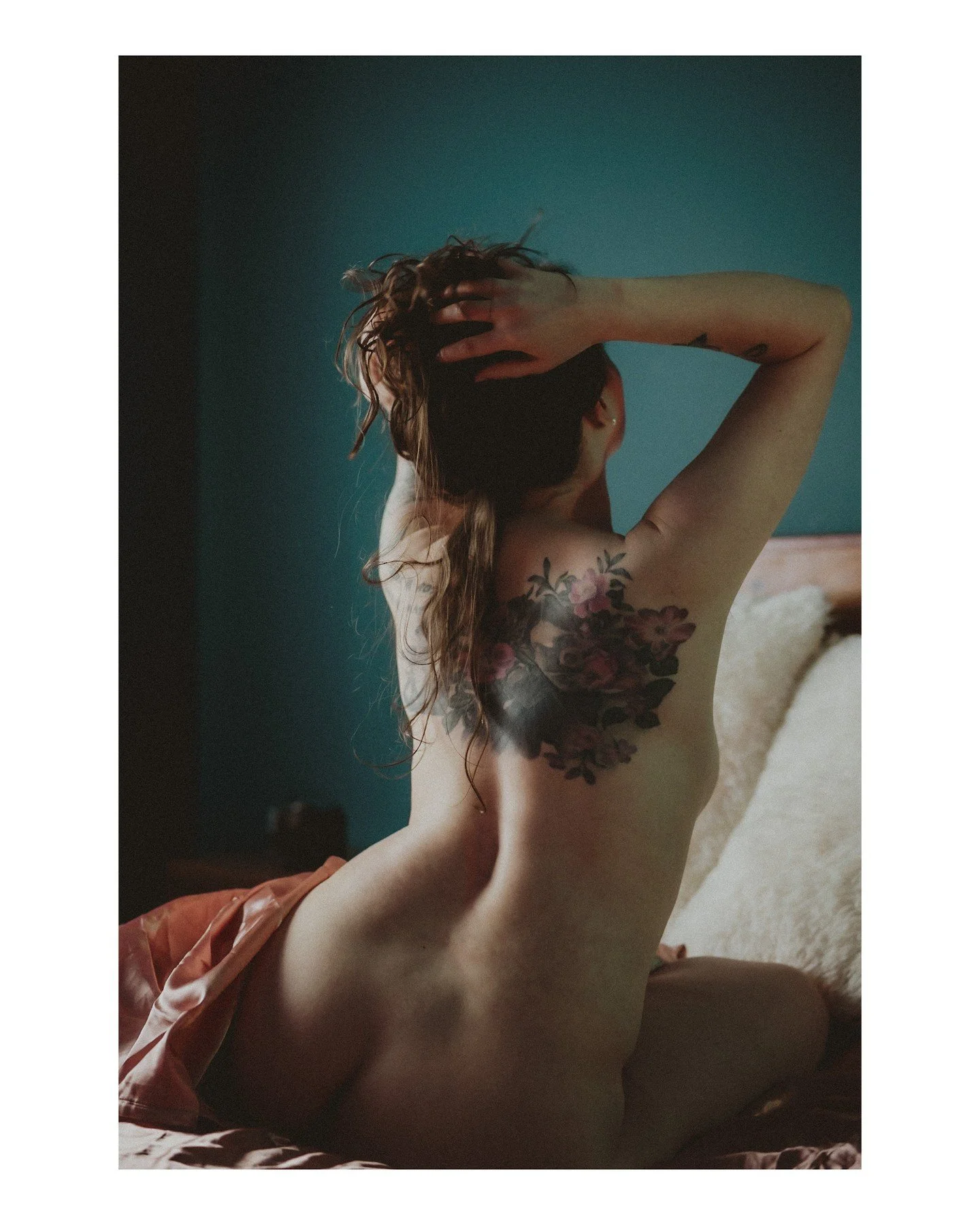 You are a work of ART 🖼️ No weight loss ad, anti-aging ad, or dehumanizing think piece can take that from you; EVER. 
.
.
.
.
.
[Image Description: A white non-binary person with long brown hair is sitting on a bed, their lower half covered by a she