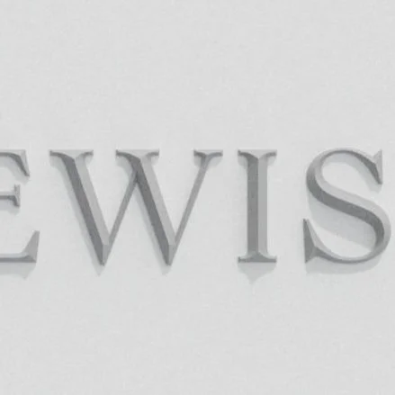 Close-up of the word "NEWS" in raised, silver letters on a white background.
